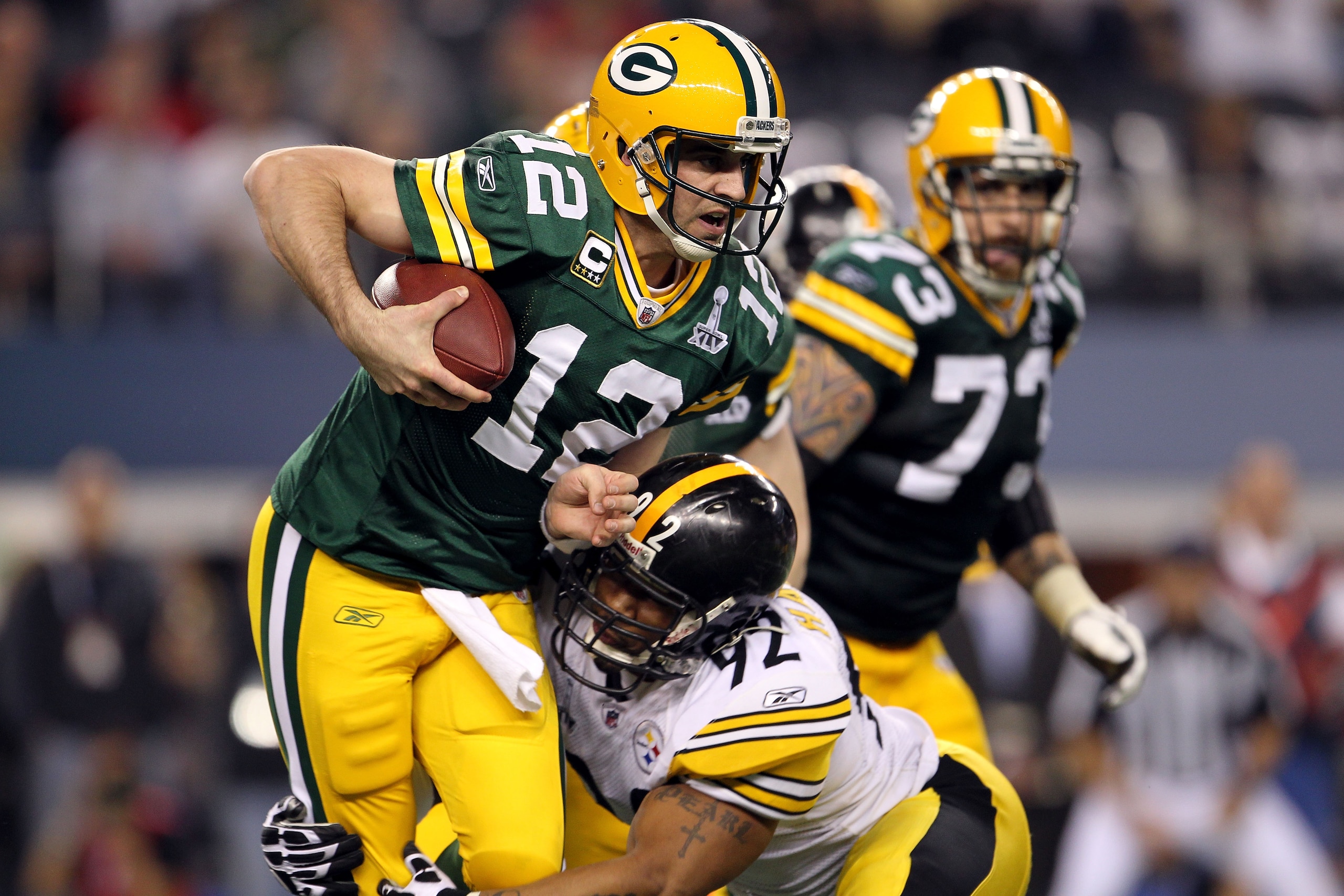 ARLINGTON, TX - FEBRUARY 06: Aaron Rodgers #12 of the Green Bay Packers is sacked by James Harrison #92 of the Pittsburgh Steelers during the second half of Super Bowl XLV at Cowboys Stadium on February 6, 2011 in Arlington, Texas. (Photo by Jamie Squir ARLINGTON, TX - FEBRUARY 06: Aaron Rodgers #12 of the Green Bay Packers is sacked by James Harrison #92 of the Pittsburgh Steelers during the second half of Super Bowl XLV at Cowboys Stadium on February 6, 2011 in Arlington, Texas. (Photo by Jamie Squir