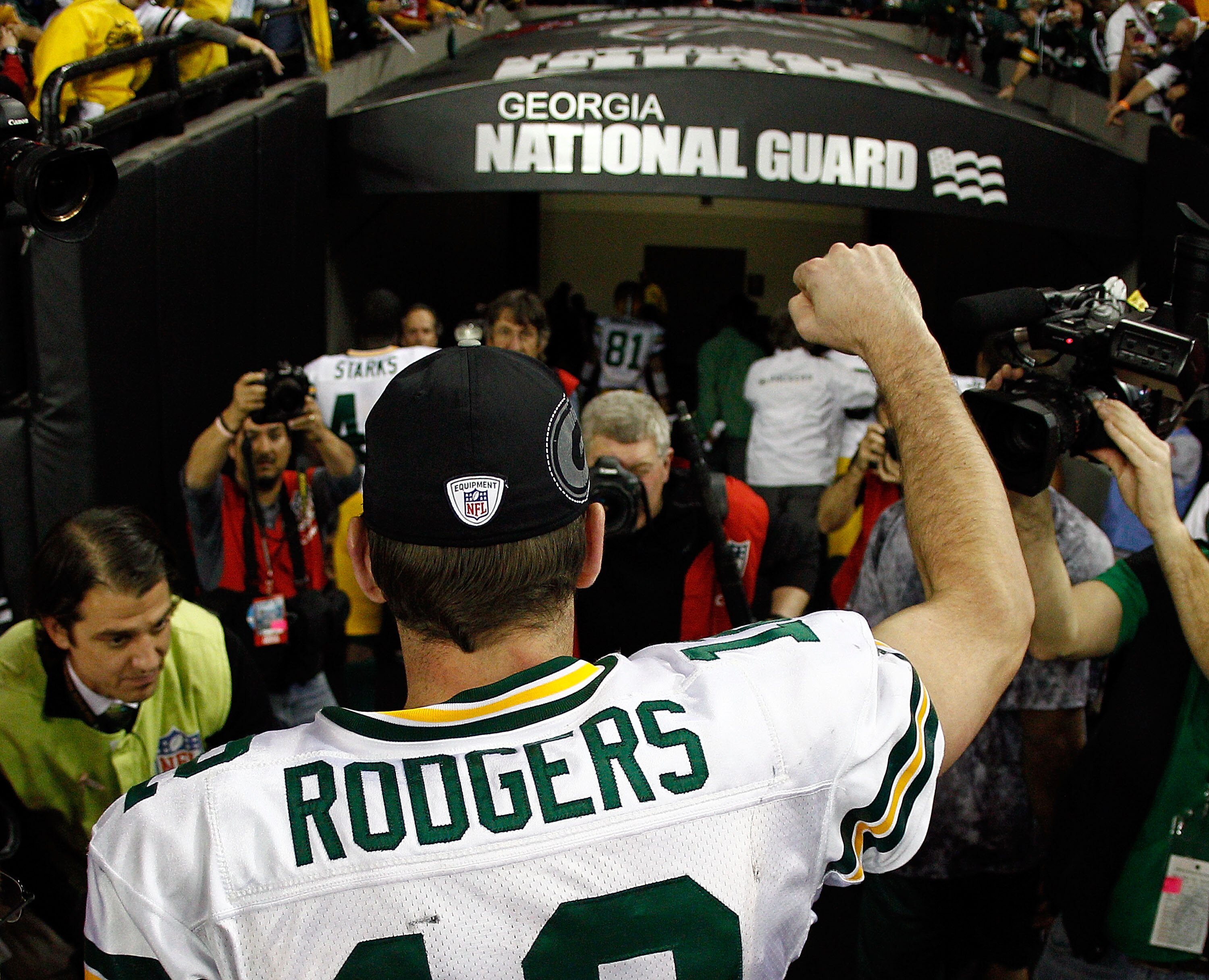 ATLANTA, GA - JANUARY 15:  Aaron Rodgers #12 of the Green Bay Packers runs off the field after the Packers won 48-21 against the Atlanta Falcons during their 2011 NFC divisional playoff game at Georgia Dome on January 15, 2011 in Atlanta, Georgia.  (Photo