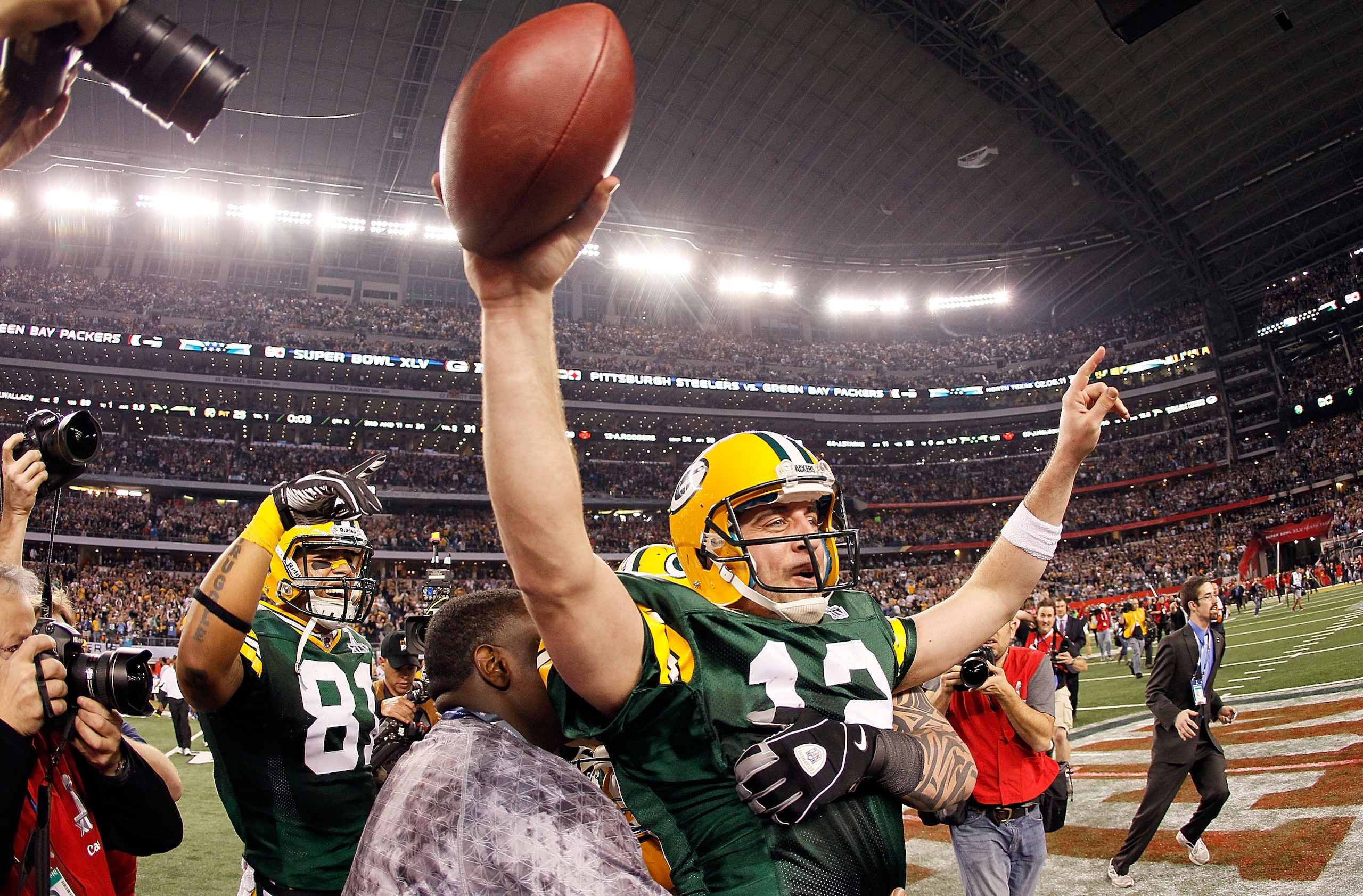 ARLINGTON, TX - FEBRUARY 06:  Aaron Rodgers #12 of the Green Bay Packers celebrates after winning Super Bowl XLV against the Pittsburgh Steelers at Cowboys Stadium on February 6, 2011 in Arlington, Texas.  (Photo by Kevin C. Cox/Getty Images)