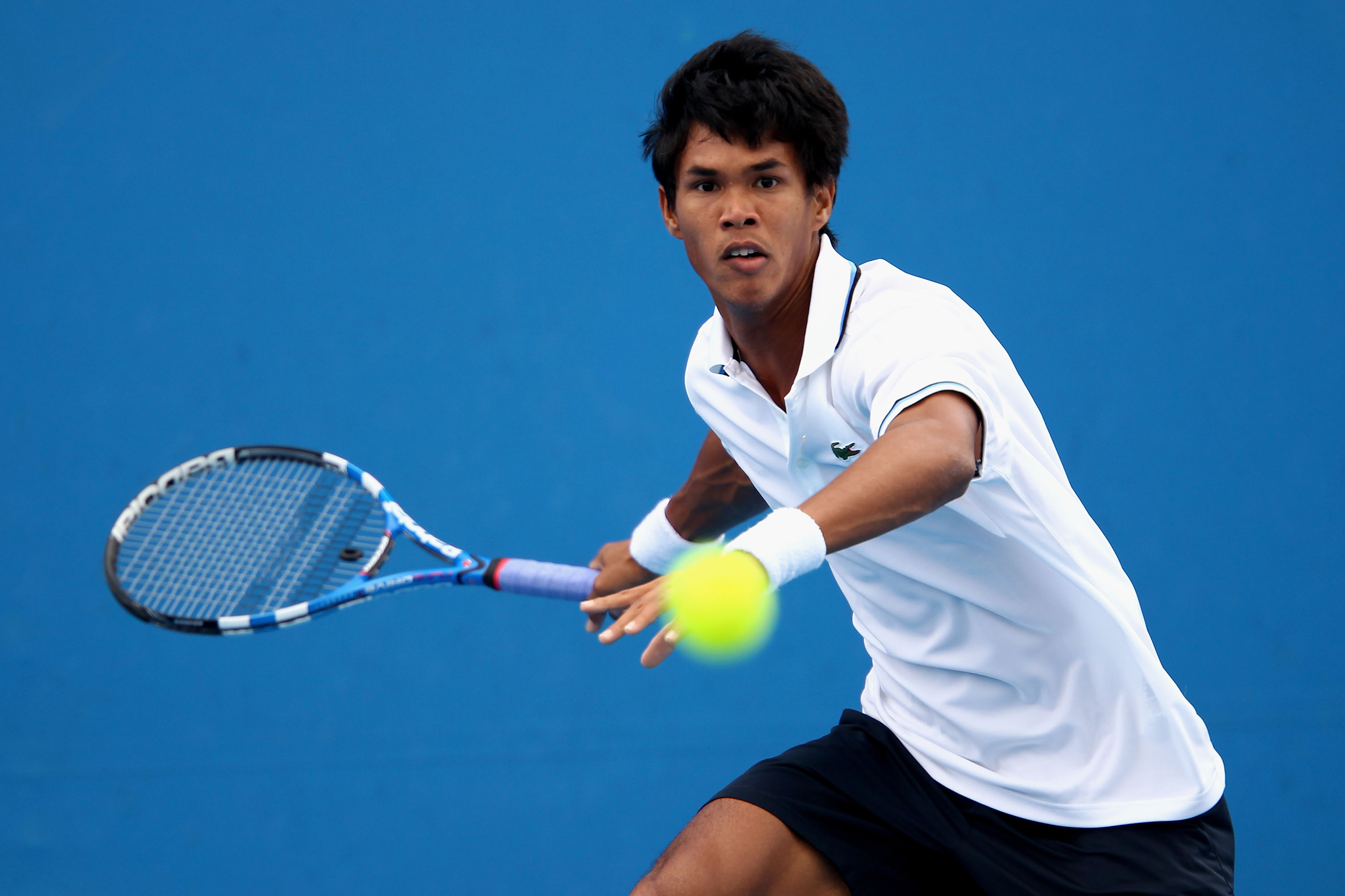 MELBOURNE, AUSTRALIA - JANUARY 17: Somdev Devvarman of India plays a forehand in his first round match against Tommy Robredo of Spain during day one of the 2011 Australian Open at Melbourne Park on January 17, 2011 in Melbourne, Australia. (Photo by Cli