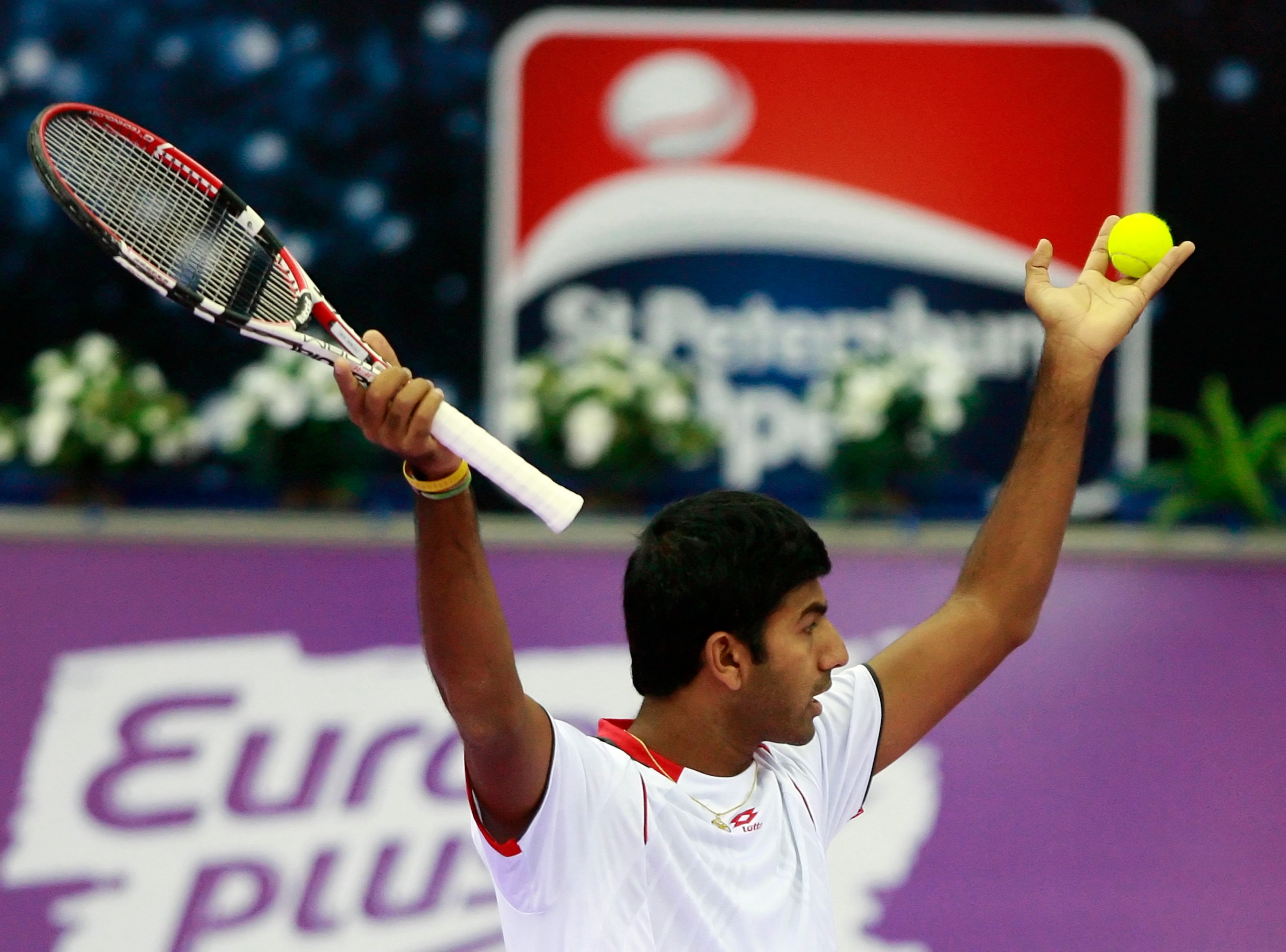 ST. PETERSBURG, RUSSIA - OCTOBER 31: Rohan Bopanna of India and Aisam-Ul-Hag Qureshi of Pakistan play against Daniele Bracciali and Potito Starace of Italy during doubles final of the International Tennis Tournamen St. Petersburg Open 2010 at the Sports C ST. PETERSBURG, RUSSIA - OCTOBER 31: Rohan Bopanna of India and Aisam-Ul-Hag Qureshi of Pakistan play against Daniele Bracciali and Potito Starace of Italy during doubles final of the International Tennis Tournamen St. Petersburg Open 2010 at the Sports C