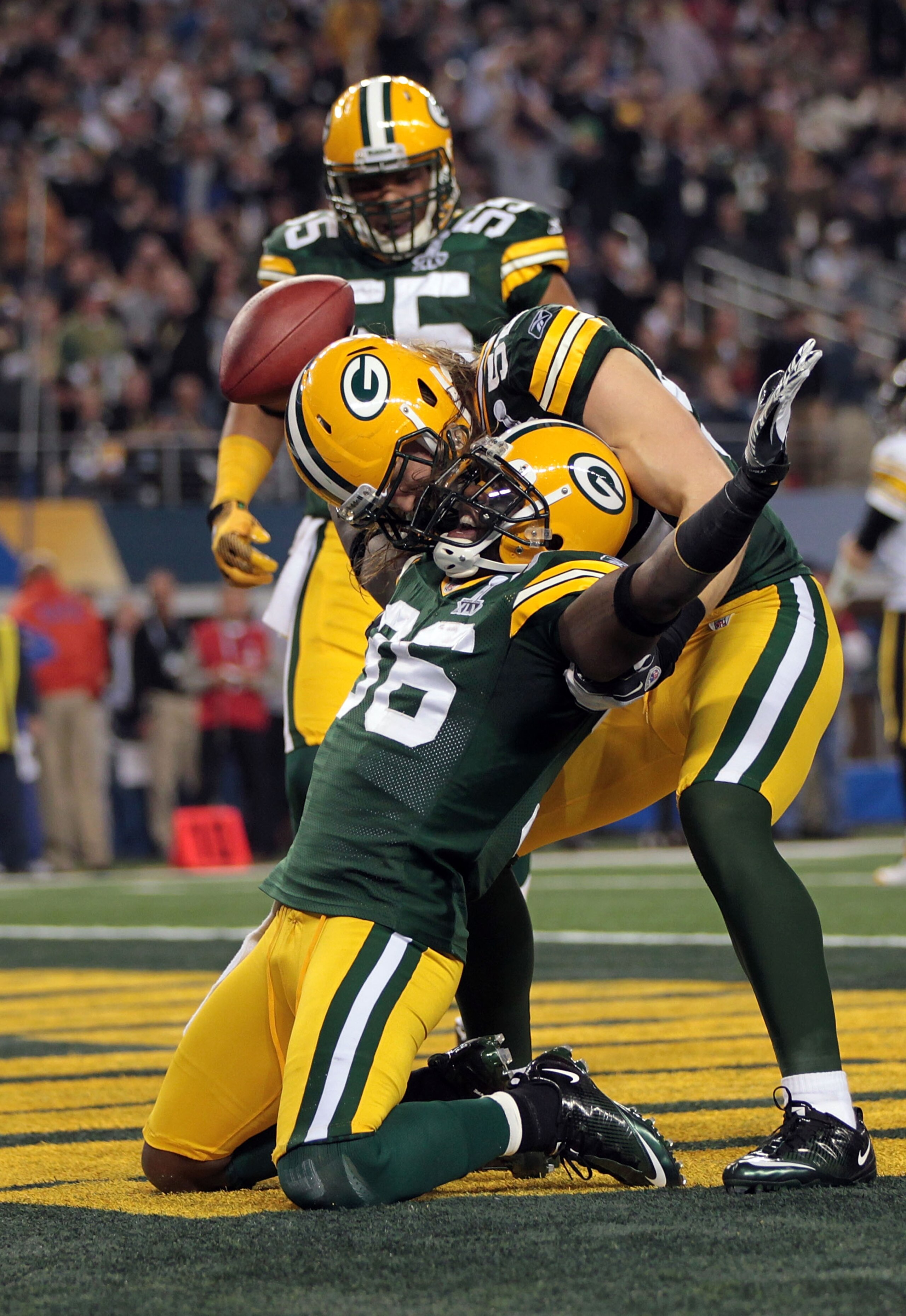 ARLINGTON, TX - FEBRUARY 06:  Nick Collins #36 of the Green Bay Packers celebrates with Clay Matthews #52 after catching an interception for a touchdown against the Pittsburgh Steelers during Super Bowl XLV at Cowboys Stadium on February 6, 2011 in Arling