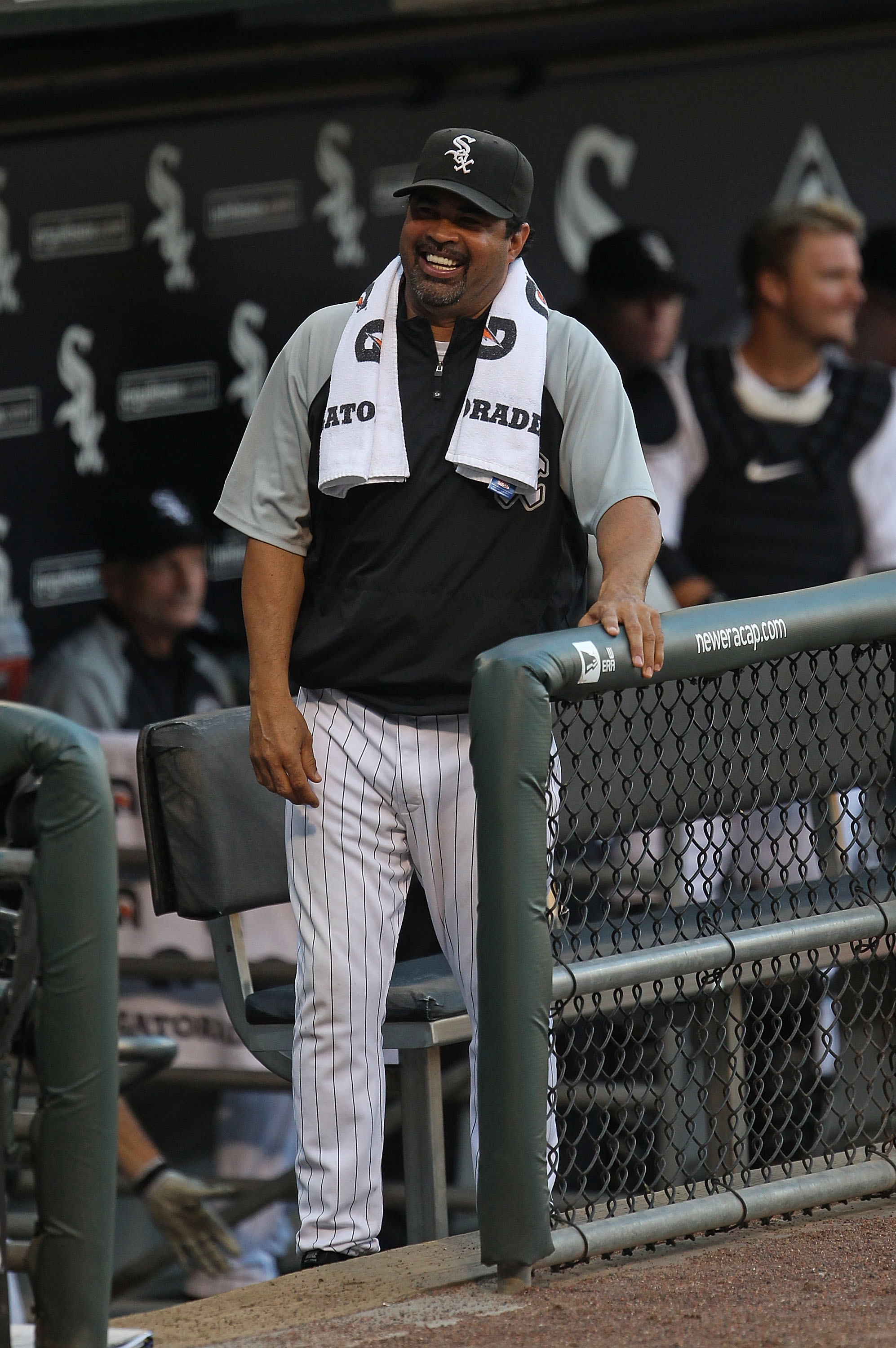 CHICAGO - JULY 26: Manager Ozzie Guillen #13 of the Chicago White Sox jokes with fans before the start of a game against the Seattle Mariners at U.S. Cellular Field on July 26, 2010 in Chicago, Illinois. The White Sox defeated the Mariners 6-1. (Photo by