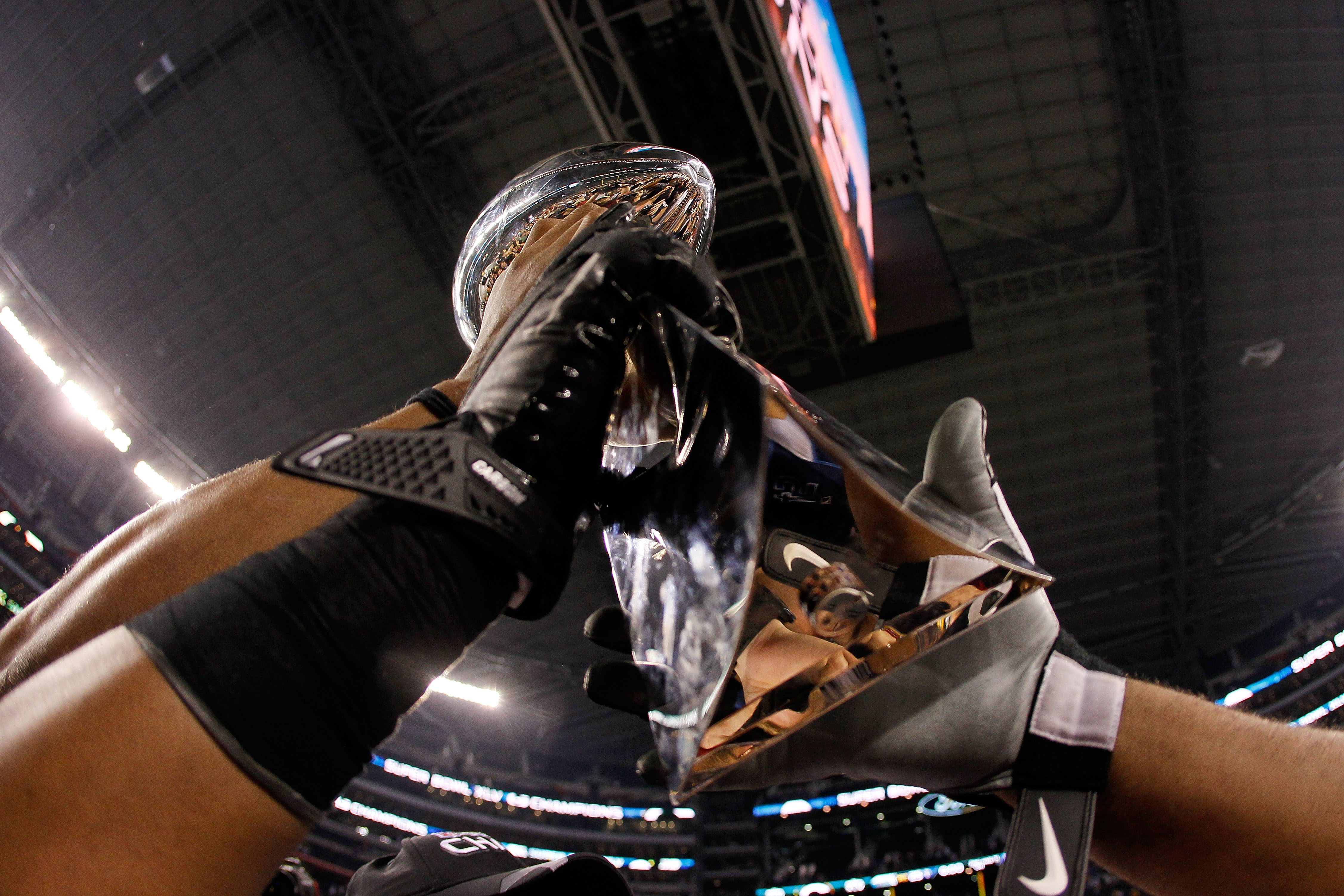 ARLINGTON, TX - FEBRUARY 06:  The Vince Lombardi Trophy is help up after the Green Bay Packers won Super Bowl XLV against the Pittsburgh Steelers at Cowboys Stadium on February 6, 2011 in Arlington, Texas.  (Photo by Kevin C. Cox/Getty Images)