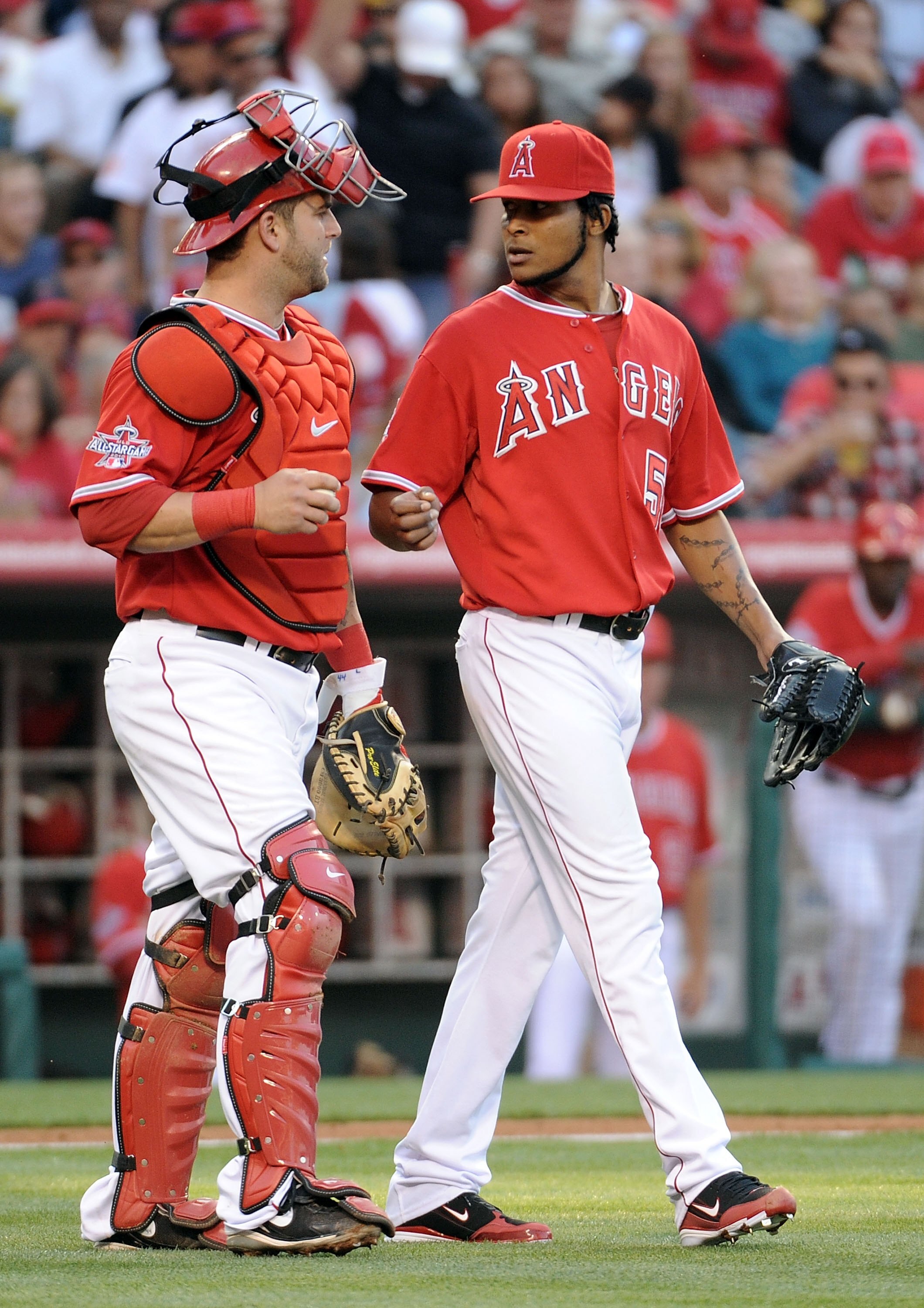 ANAHEIM, CA - MAY 15:  Ervin Santana #54 and Mike Napoli #44 of the Los Angeles Angels talk after a run scored by the Oakland Athletics at Angels Stadium on May 15, 2010 in Anaheim, California.  (Photo by Harry How/Getty Images)