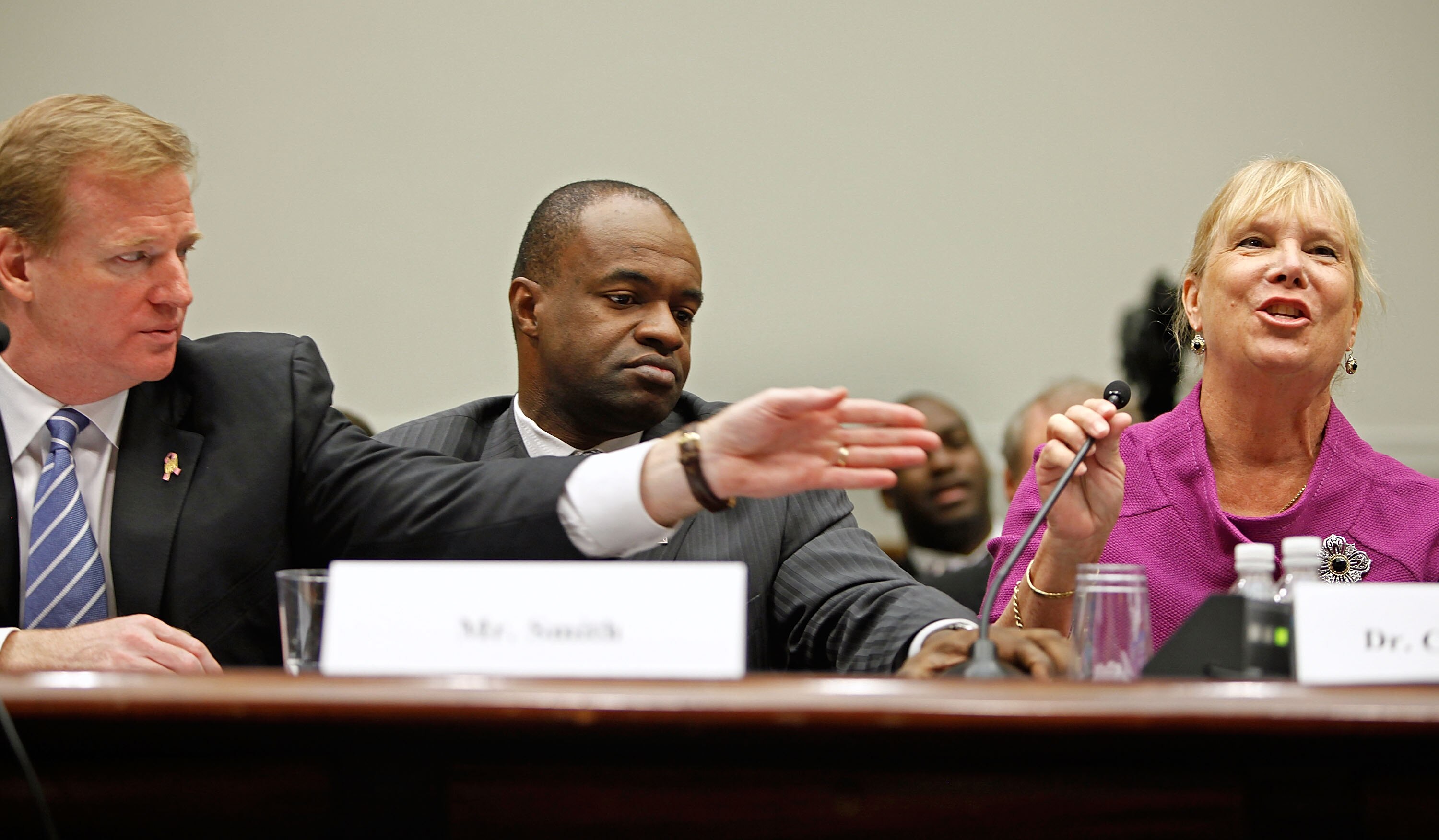 WASHINGTON - OCTOBER 28:  Tampa Bay Bucaneers former President Gay Culverhouse (R) gets help with her microphone from National Football League Commissioner Roger Goodell (L) and NFL Players Association Executive Director DeMaurice Smith (C) while testifyi