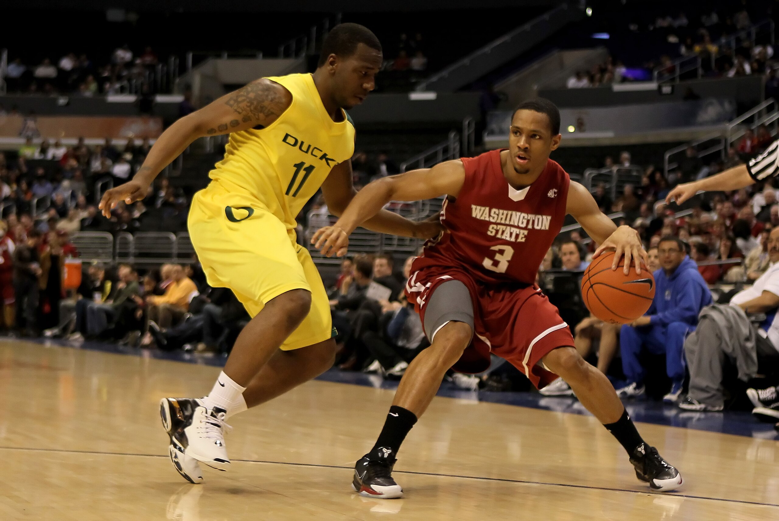 LOS ANGELES, CA - MARCH 10:  Reggie Moore #3 of the Washington State Cougars is defended by Malcolm Armstead #11 of the Oregon Ducks in the first half during the first round of the Pac-10 Basketball Tournament at Staples Center on March 10, 2010 in Los An