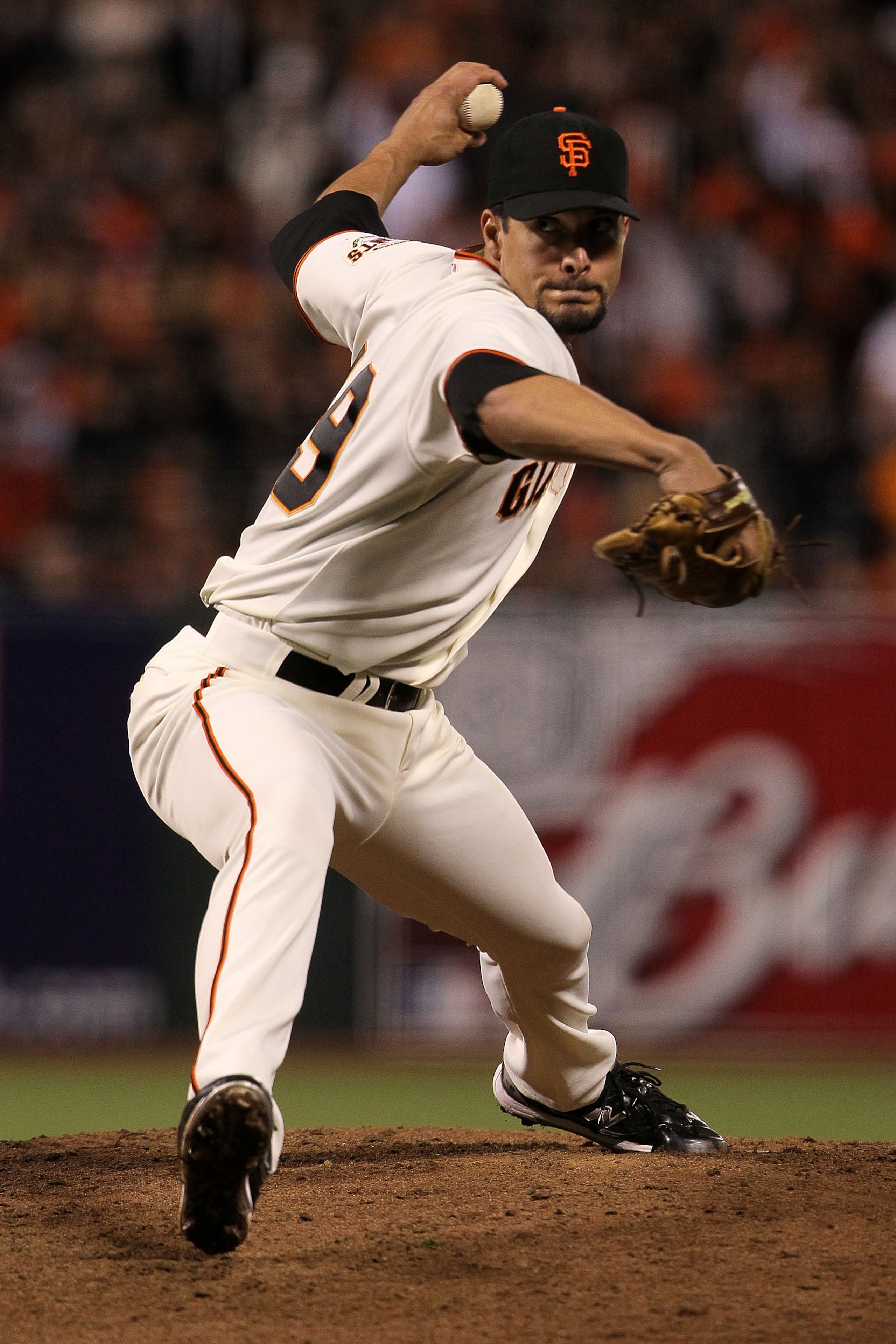 SAN FRANCISCO - OCTOBER 21:  Javier Lopez #49 of the San Francisco Giants throws a pitch against the Philadelphia Phillies in the eighth inning of Game Five of the NLCS during the 2010 MLB Playoffs at AT&T Park on October 21, 2010 in San Francisco, Califo