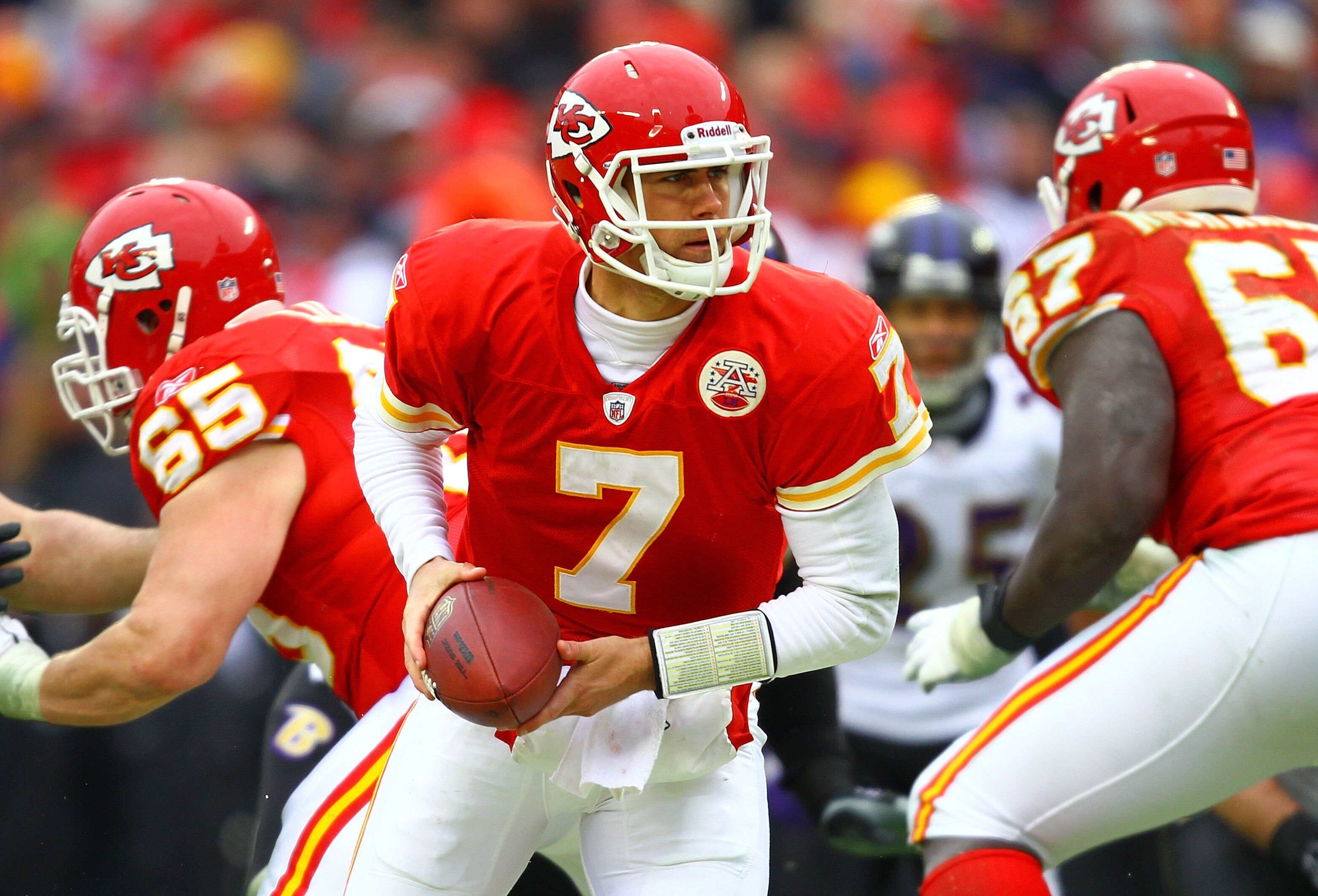KANSAS CITY, MO - JANUARY 09:  Quarterback Matt Cassel #7 of the Kansas City Chiefs rolls out against the Baltimore Ravens in their 2011 AFC wild card playoff game at Arrowhead Stadium on January 9, 2011 in Kansas City, Missouri.  (Photo by Dilip Vishwana