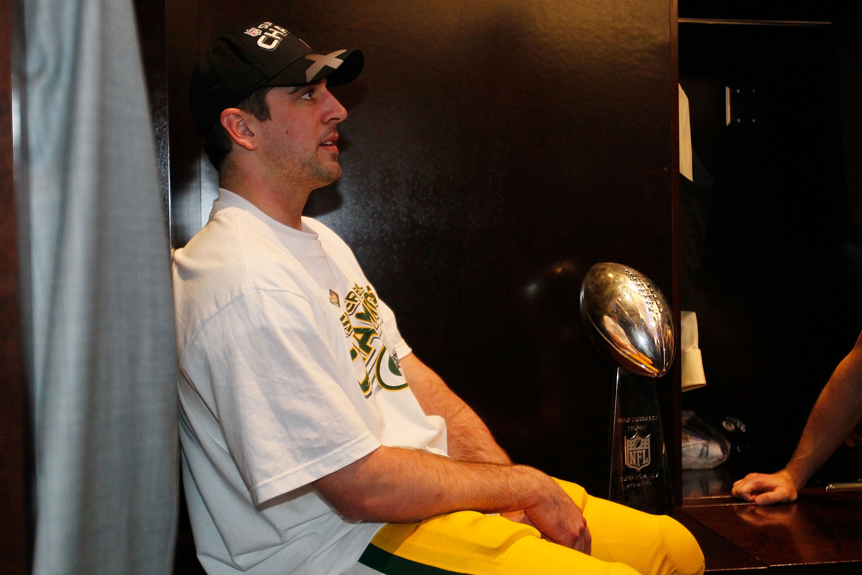 ARLINGTON, TX - FEBRUARY 06:  Super Bowl MVP Aaron Rodgers #12 of the Green Bay Packers celebrates in the locker room with the Vince Lombardi Trophy after the Green Bay Packers defeated the Pittsburgh Steelers 31 to 25 in Super Bowl XLV at Cowboys Stadium