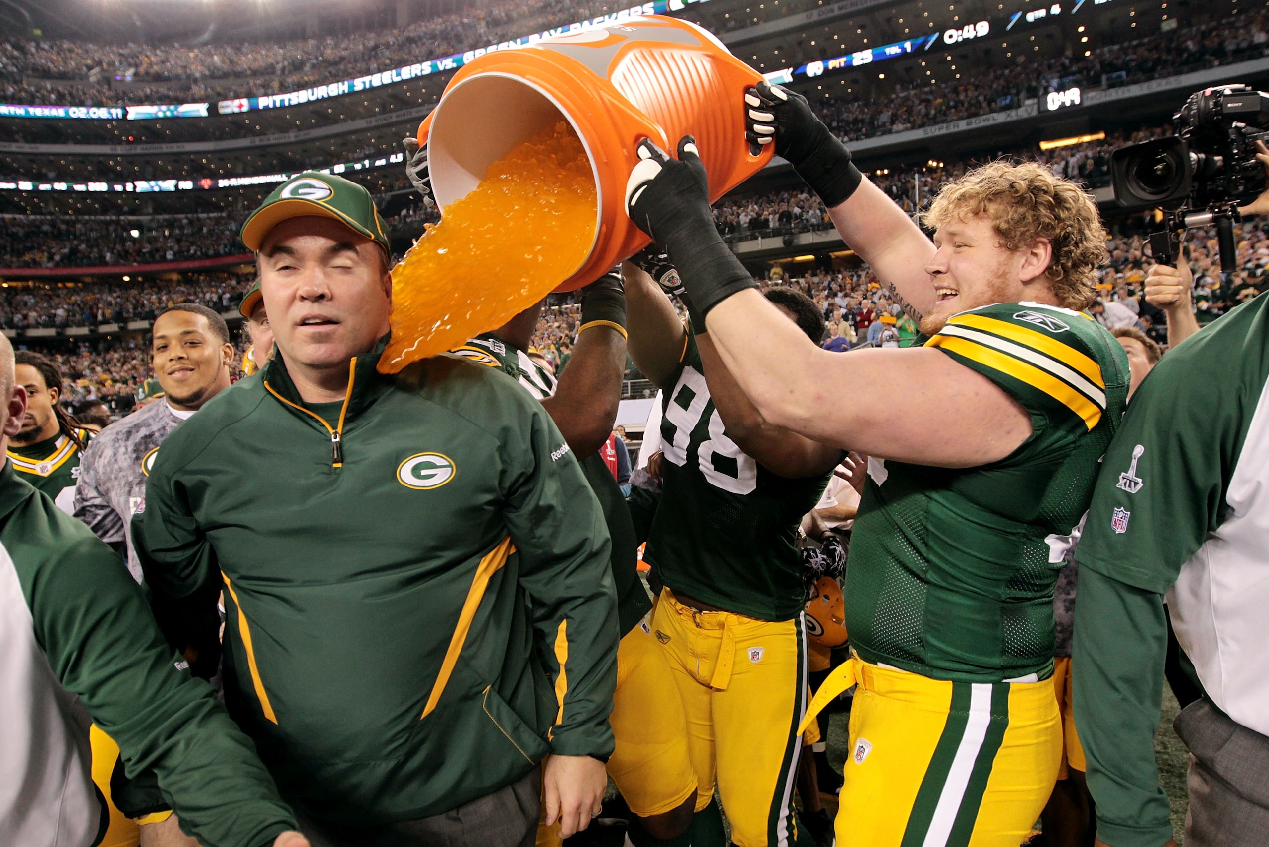 ARLINGTON, TX - FEBRUARY 06: C.J. Wilson #98, T.J. Lang #70 and Ryan Pickett #79 of the Green Bay Packers dump Gatorade on head coach Mike McCarthy after they defeated the Pittsburgh Steelers 31 to 25 in Super Bowl XLV at Cowboys Stadium on February 6, 2 ARLINGTON, TX - FEBRUARY 06: C.J. Wilson #98, T.J. Lang #70 and Ryan Pickett #79 of the Green Bay Packers dump Gatorade on head coach Mike McCarthy after they defeated the Pittsburgh Steelers 31 to 25 in Super Bowl XLV at Cowboys Stadium on February 6, 2