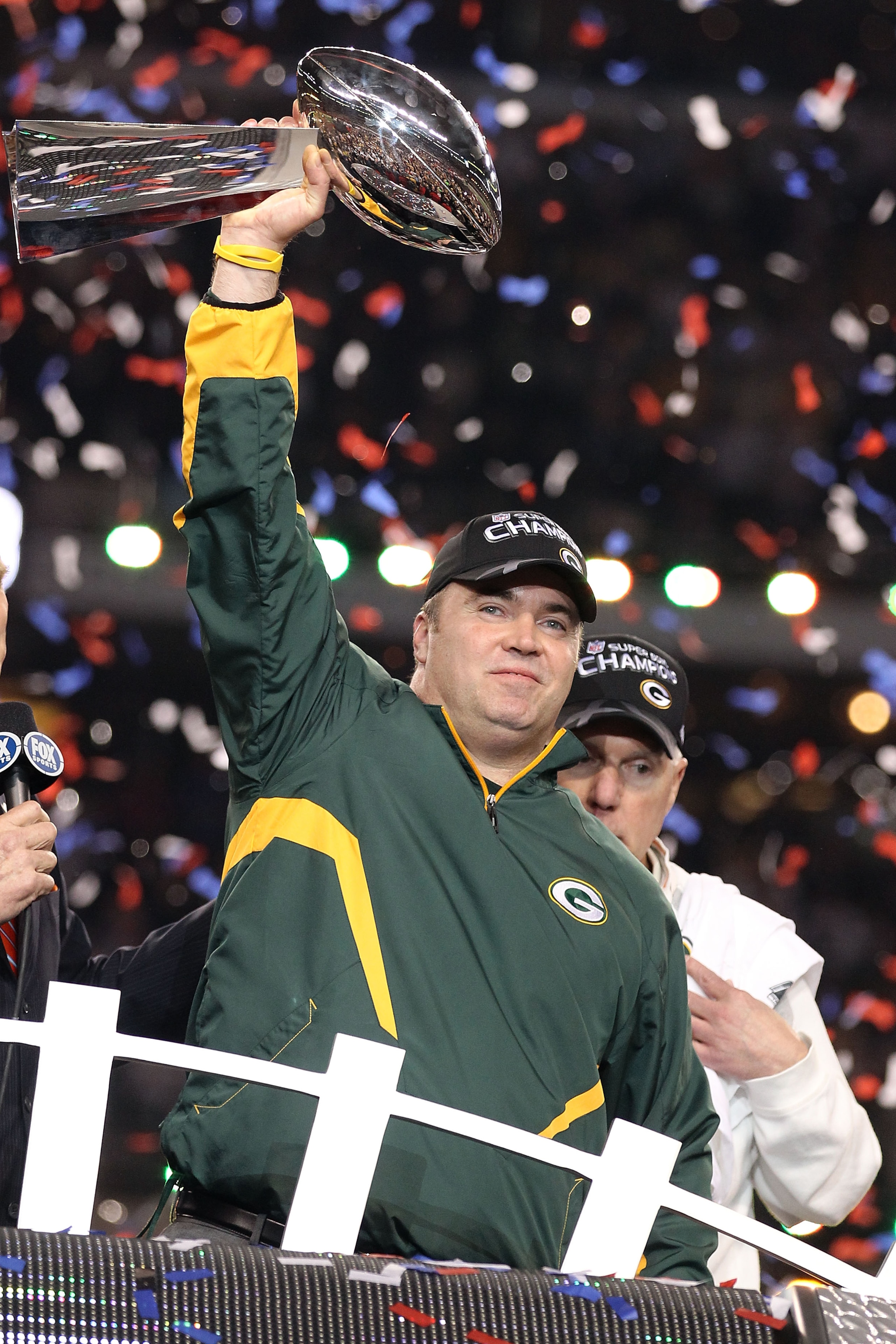 ARLINGTON, TX - FEBRUARY 06: Head coach Mike McCarthy of the Green Bay Packers holds up the Vince Lombardi Trophy after winning Super Bowl XLV 31-25 against the Pittsburgh Steelers at Cowboys Stadium on February 6, 2011 in Arlington, Texas. (Photo by Al ARLINGTON, TX - FEBRUARY 06: Head coach Mike McCarthy of the Green Bay Packers holds up the Vince Lombardi Trophy after winning Super Bowl XLV 31-25 against the Pittsburgh Steelers at Cowboys Stadium on February 6, 2011 in Arlington, Texas. (Photo by Al