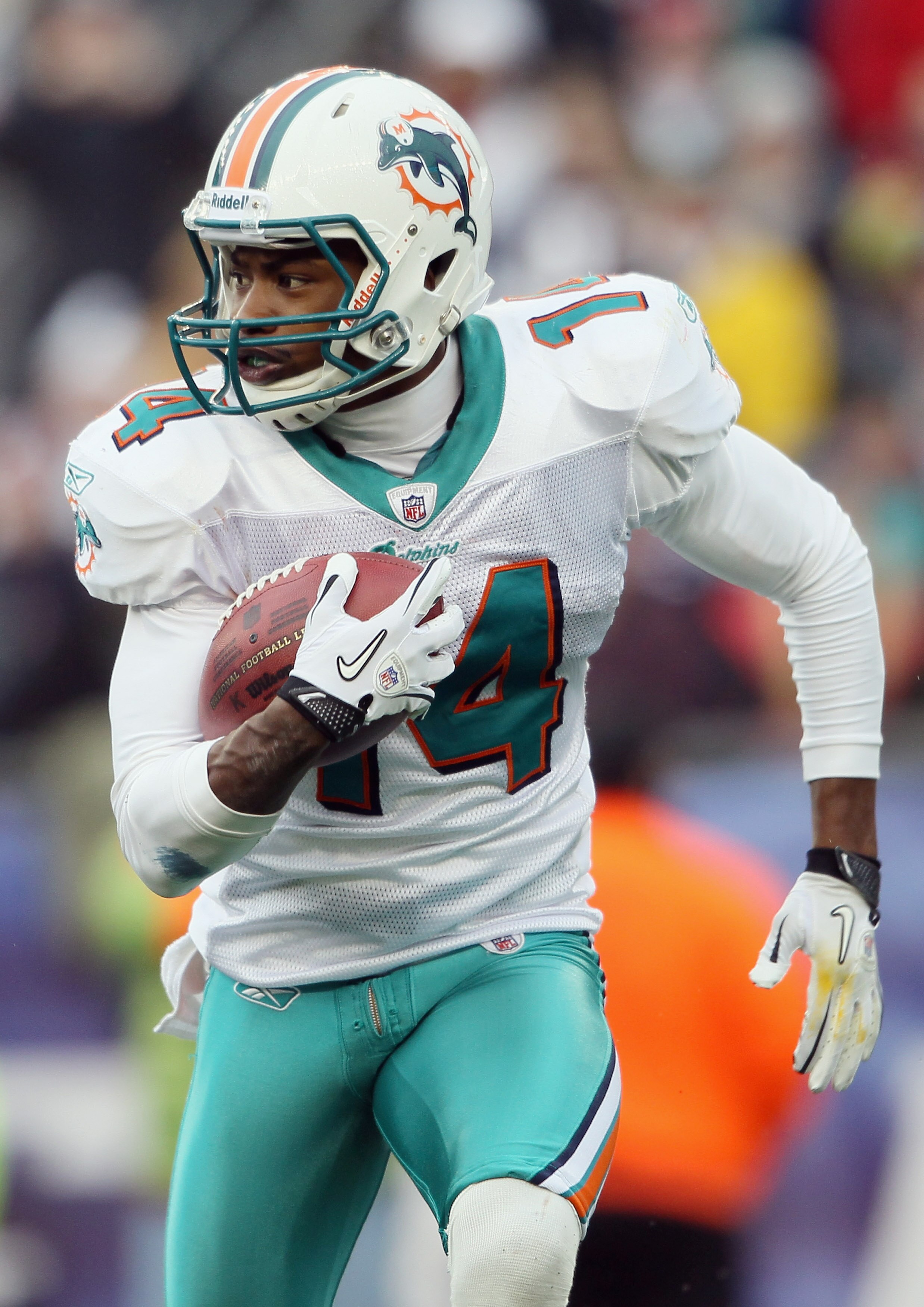 FOXBORO, MA - JANUARY 02:  Marlon Moore #14 of the Miami Dolphins carries the ball in the first half against the New England Patriots on January 2, 2011 at Gillette Stadium in Foxboro, Massachusetts.  (Photo by Elsa/Getty Images)
