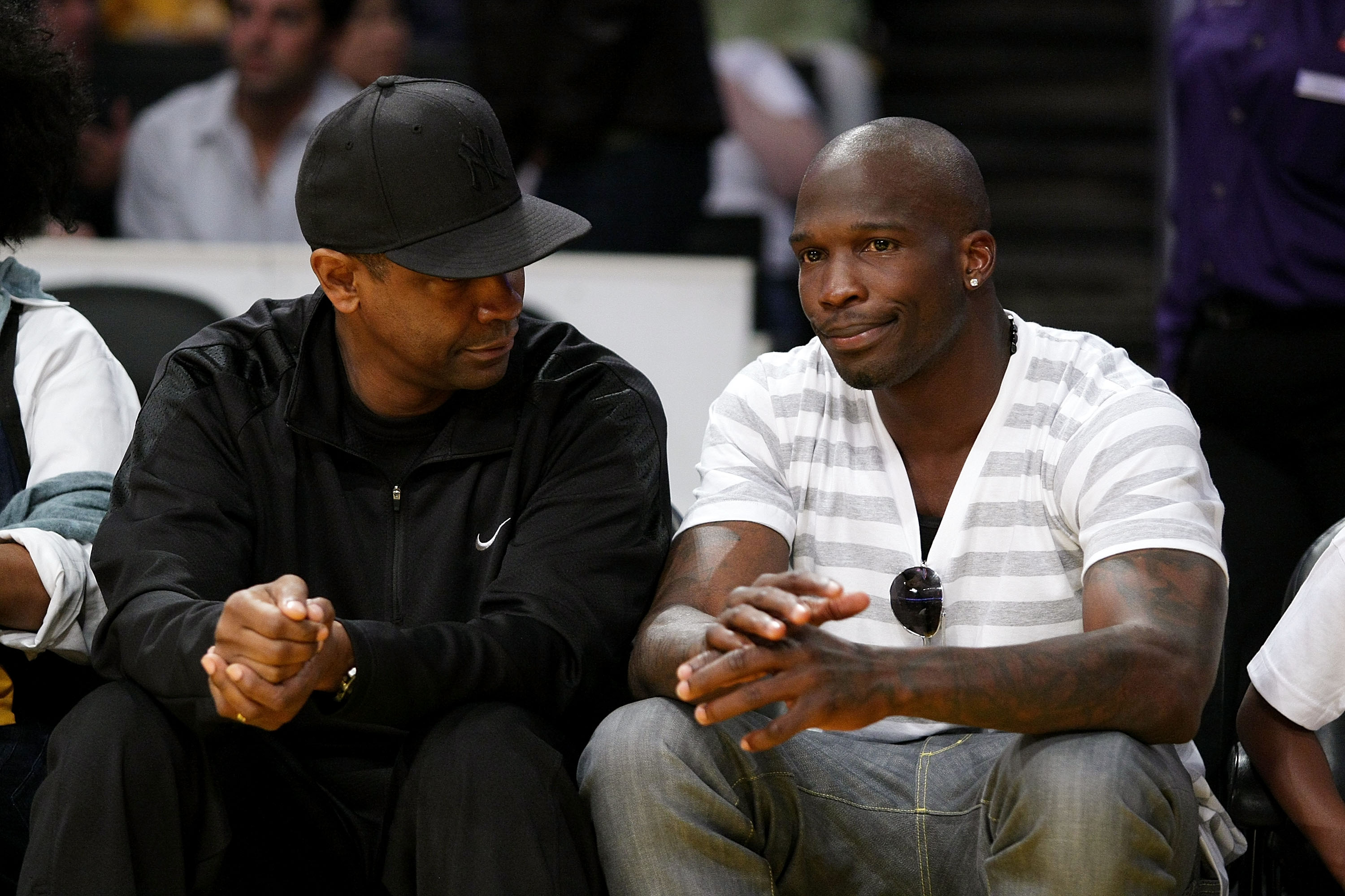 LOS ANGELES, CA - MAY 19:  Chad Ocho Cinco (R) and Denzel Washington (L) attend Game One of the Western Conference Finals during the 2009 NBA Playoffs between the Los Angeles Lakers and the Denver Nuggets at Staples Center on May 19, 2009 in Los Angeles,