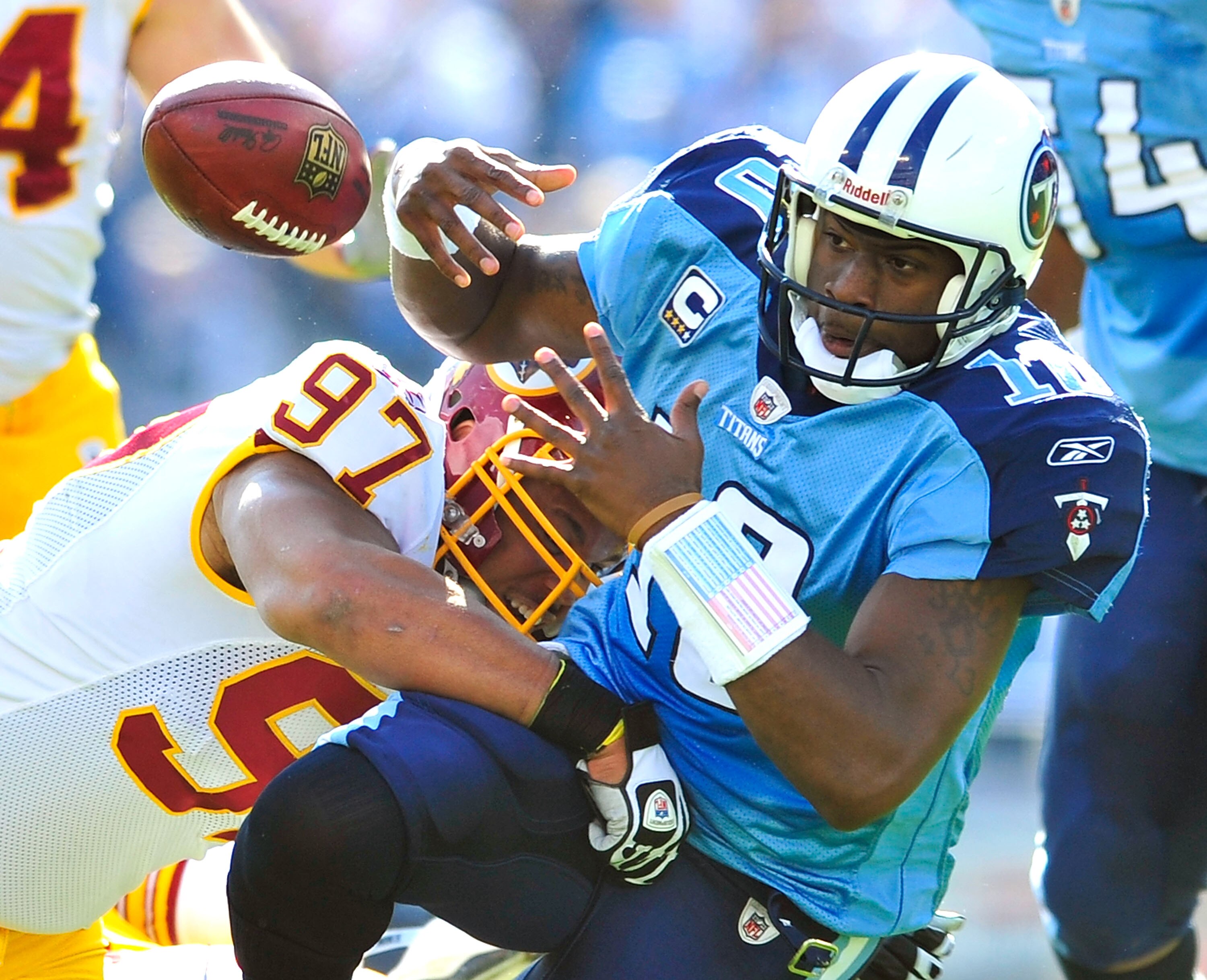 NASHVILLE, TN - NOVEMBER 21:  Lorenzo Alexander #97 of the Washington Redskins forces a fumble by quarterback Vince Young #10 of the Tennessee Titans during the first half at LP Field on November 21, 2010 in Nashville, Tennessee.  (Photo by Grant Halverso
