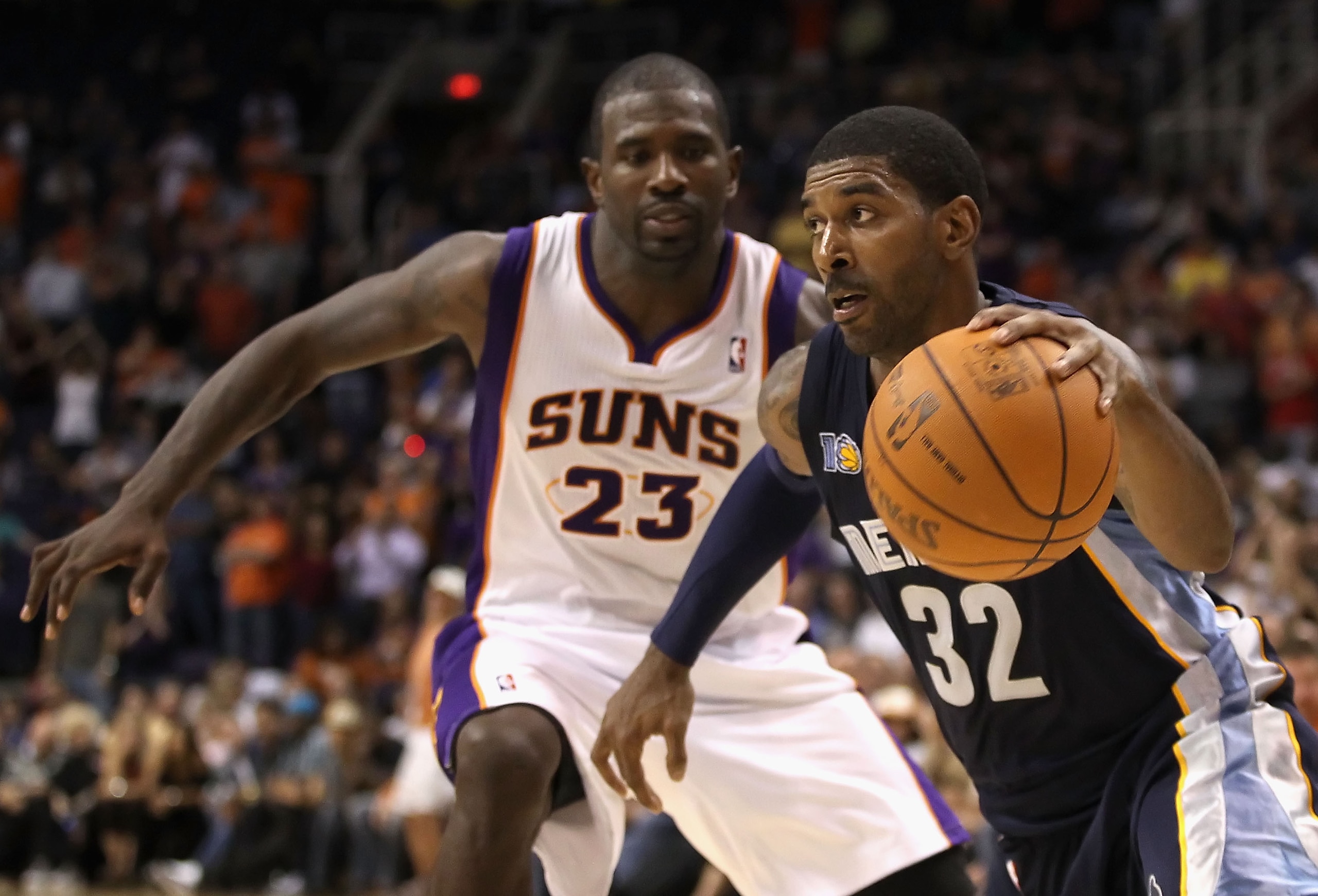 PHOENIX - NOVEMBER 05:  O.J. Mayo #32 of the Memphis Grizzlies drives the ball past Jason Richardson #23 of the Phoenix Suns during the NBA game at US Airways Center on November 5, 2010 in Phoenix, Arizona. The Suns defeated the Grizzlies 123-118 in doubl