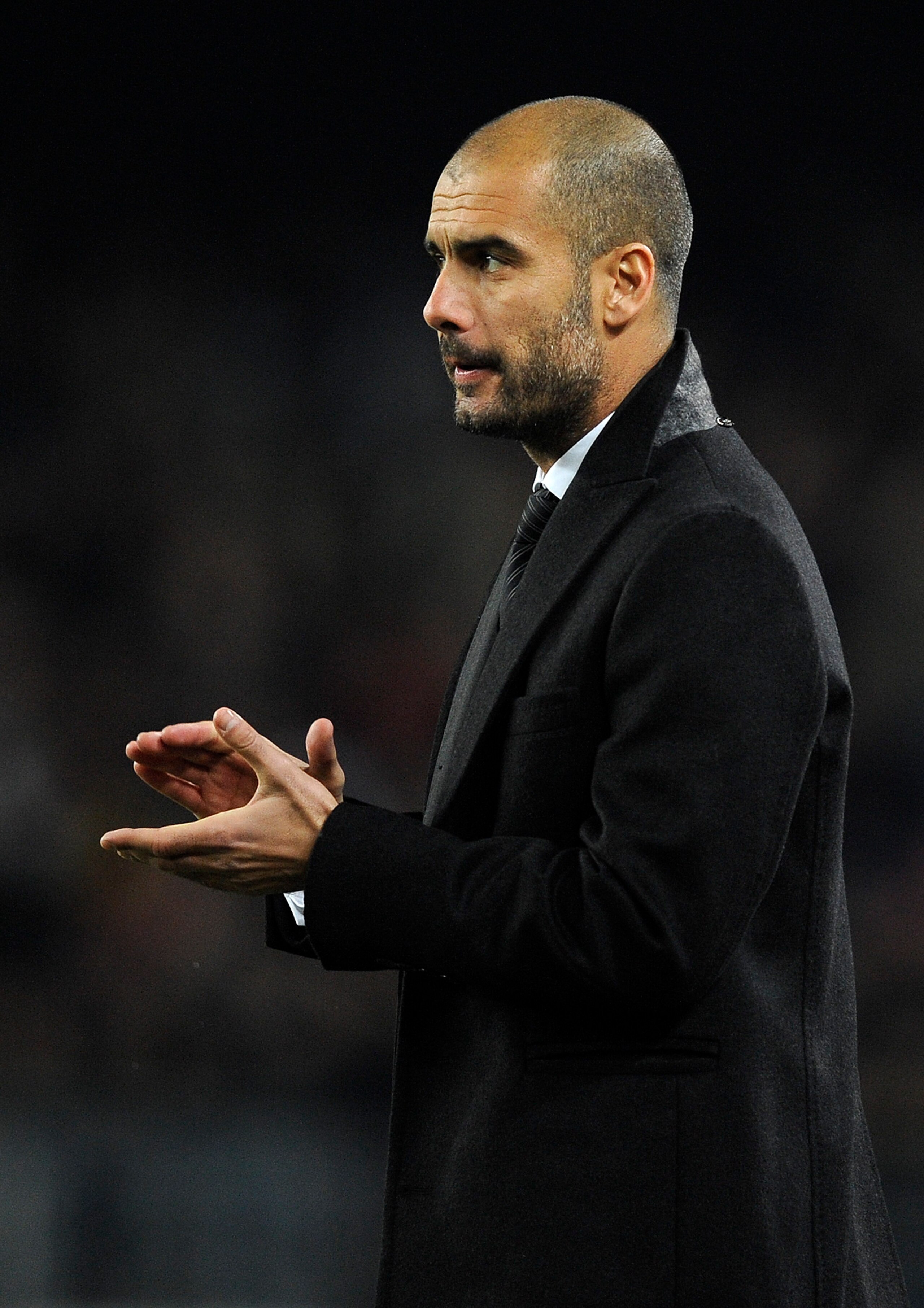 BARCELONA, SPAIN - DECEMBER 12:  Head coach Josep Guardiola of Barcelona claps his hands during the La Liga match between Barcelona and Real Sociedad at Camp Nou Stadium on December 12, 2010 in Barcelona, Spain. Barcelona won the match 5-0.  (Photo by Dav