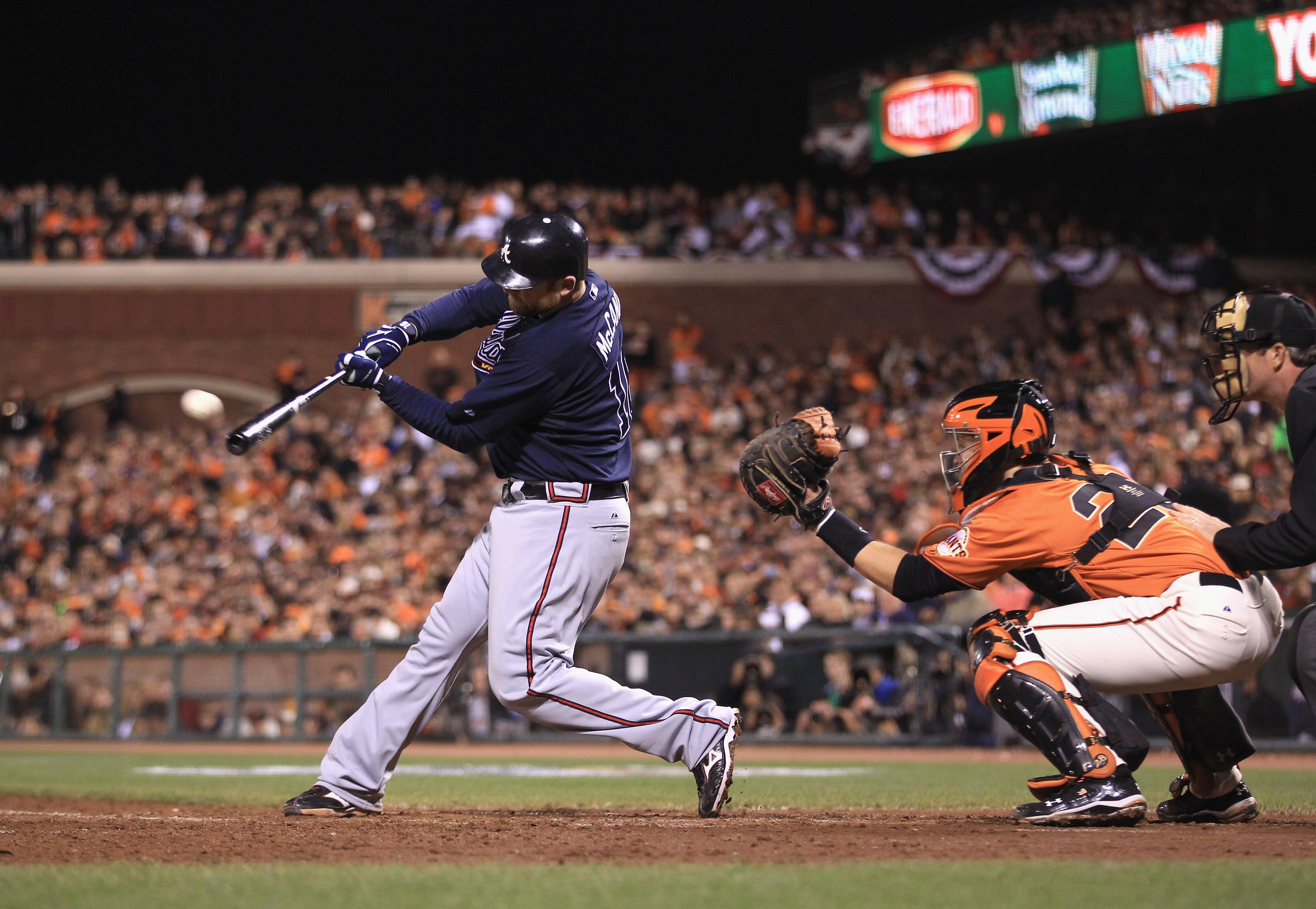 SAN FRANCISCO - OCTOBER 08:  Brian McCann #16 of the Atlanta Braves hits a single that scored Derrek Lee in the sixth inning of their game against the San Francisco Giants in game 2 of the NLDS at AT&T Park on October 8, 2010 in San Francisco, California.