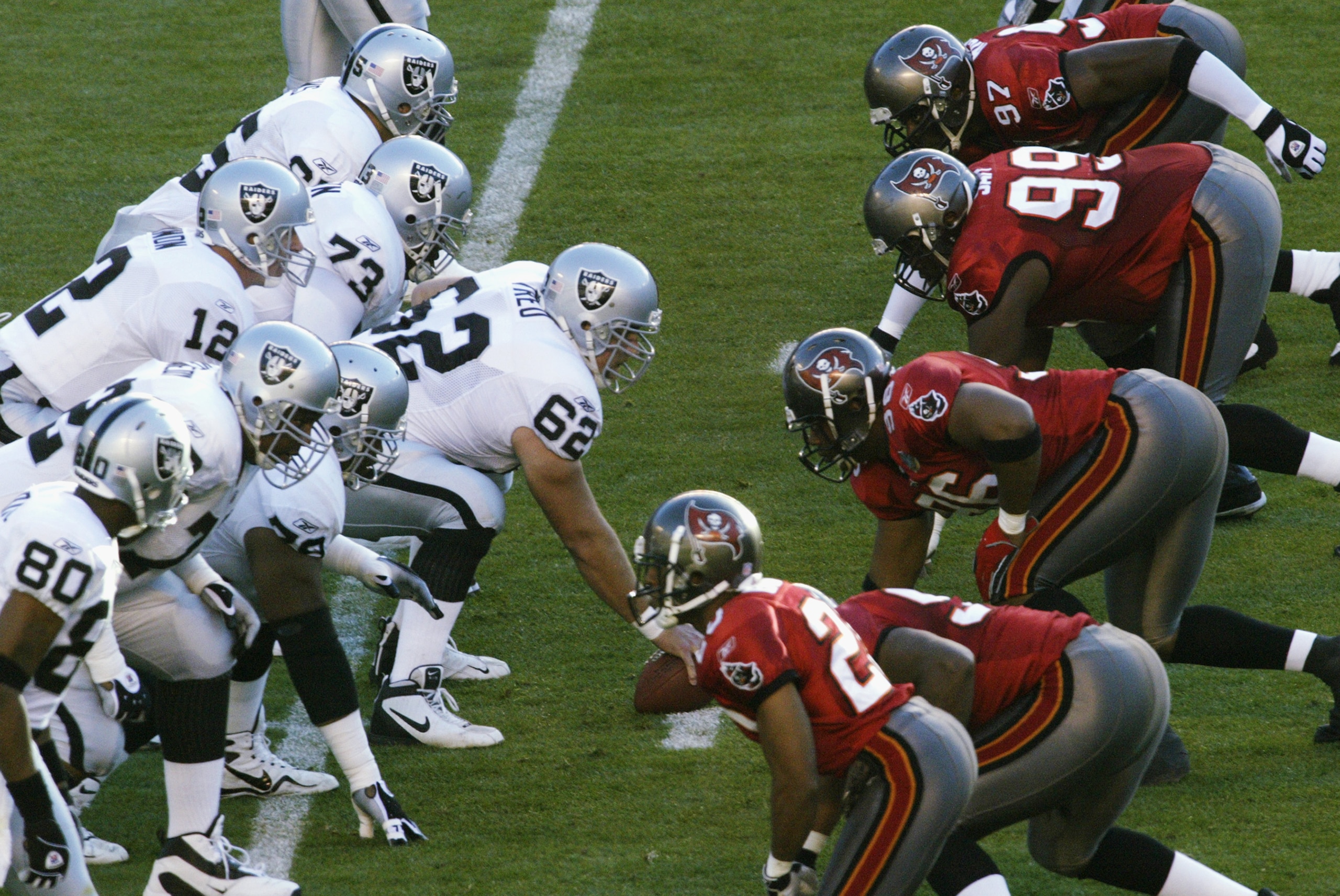 SAN DIEGO - JANUARY 26:  Center Adam Treu #62 of the Oakland Raiders (starting for Barret Robbins) readies to hike the ball as the offense lines up against the Tampa Bay Buccaneers defense during Super Bowl XXXVII on January 26, 2003 at Qualcomm Stadium i