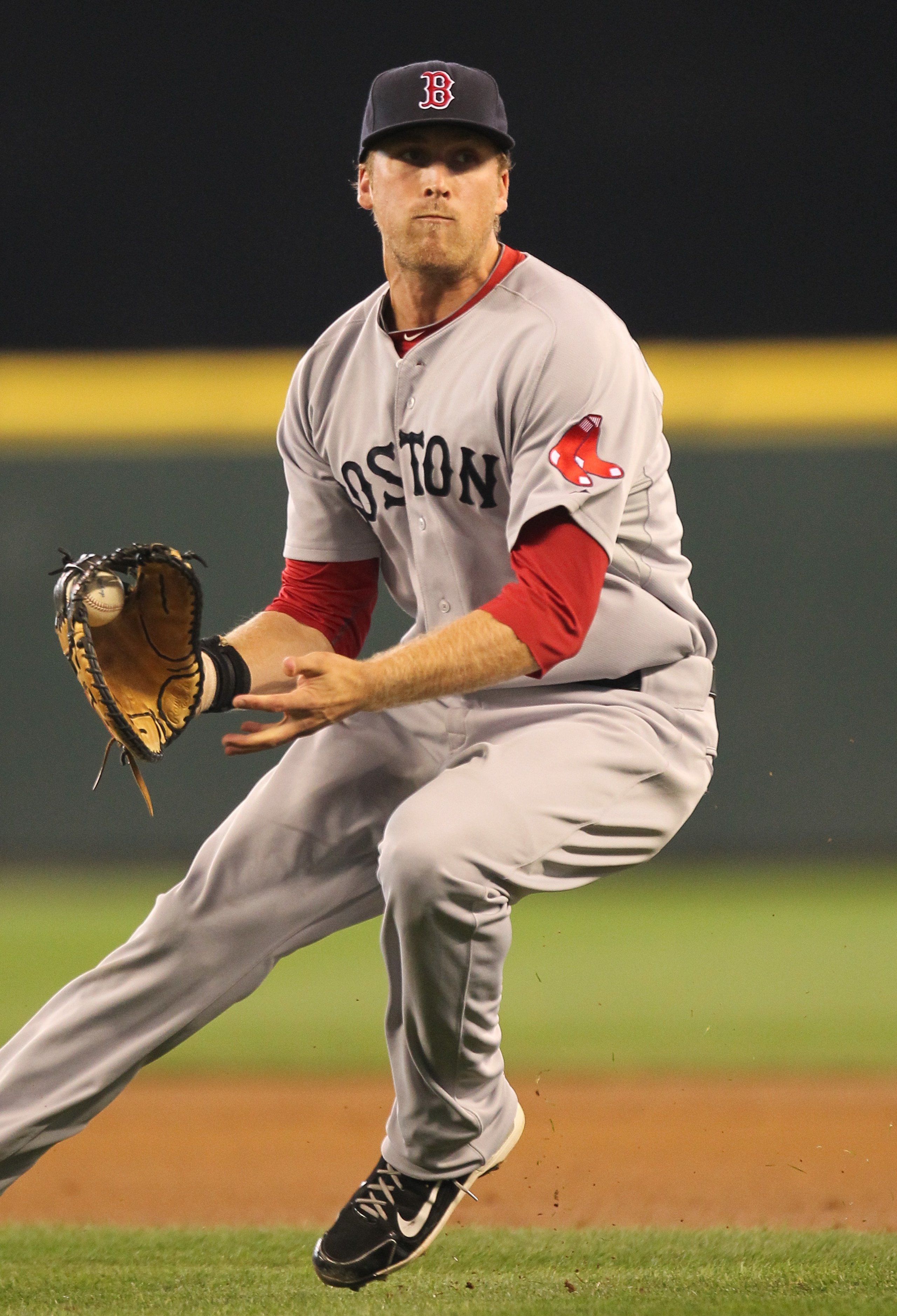SEATTLE - SEPTEMBER 15: First baseman Lars Anderson #44 of the Boston Red Sox fields a bunt during the game against the Seattle Mariners at Safeco Field on September 15, 2010 in Seattle, Washington. (Photo by Otto Greule Jr/Getty Images) SEATTLE - SEPTEMBER 15: First baseman Lars Anderson #44 of the Boston Red Sox fields a bunt during the game against the Seattle Mariners at Safeco Field on September 15, 2010 in Seattle, Washington. (Photo by Otto Greule Jr/Getty Images)