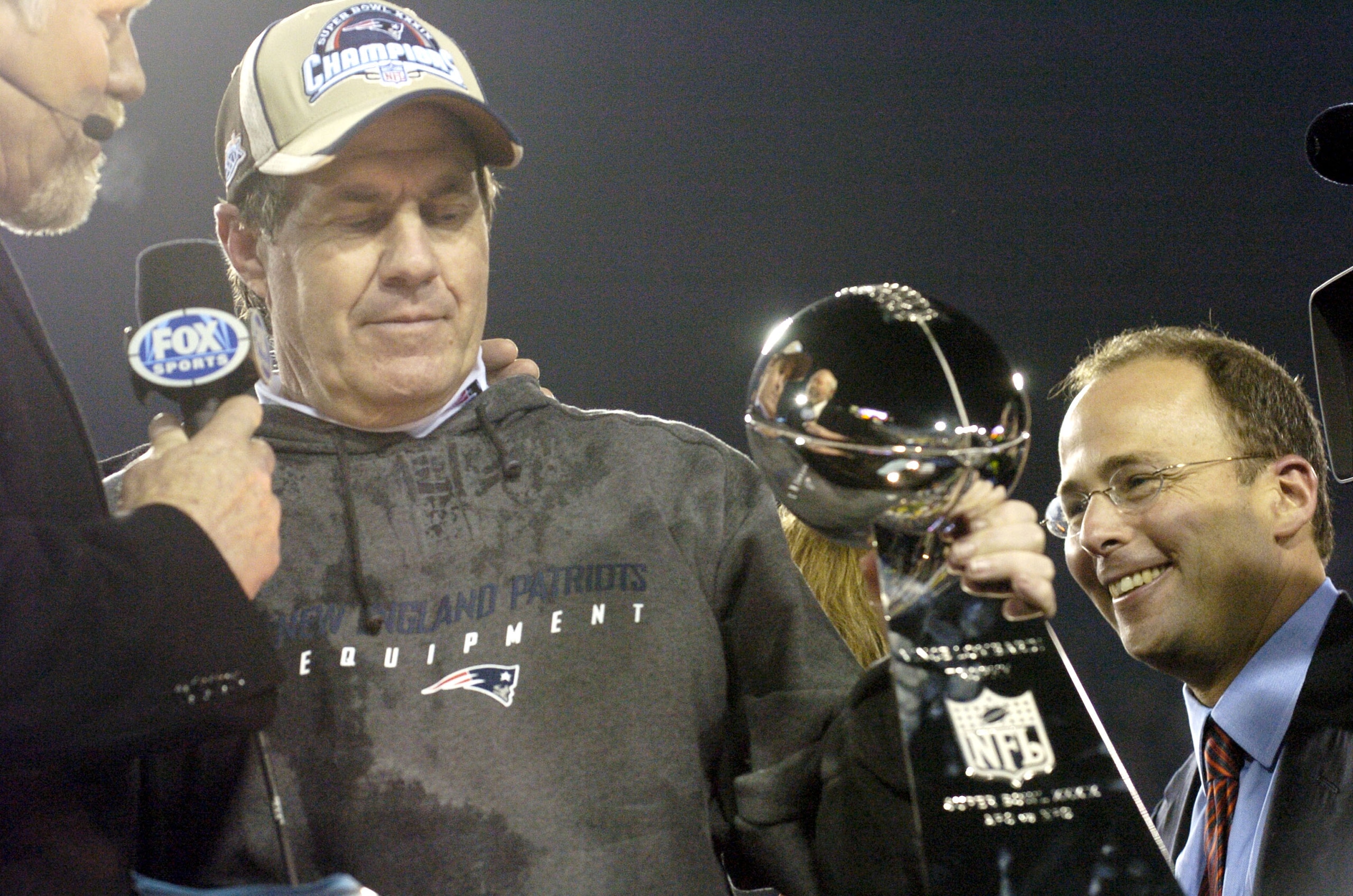 New England Patriots Head Coach Bill Belichick holds The Vince Lombardi Trophy after the Patriots won Super Bowl XXXIX at Alltel Stadium in Jacksonville, Florida on February 6, 2005.  (Photo by Al Messerschmidt/Getty Images)
