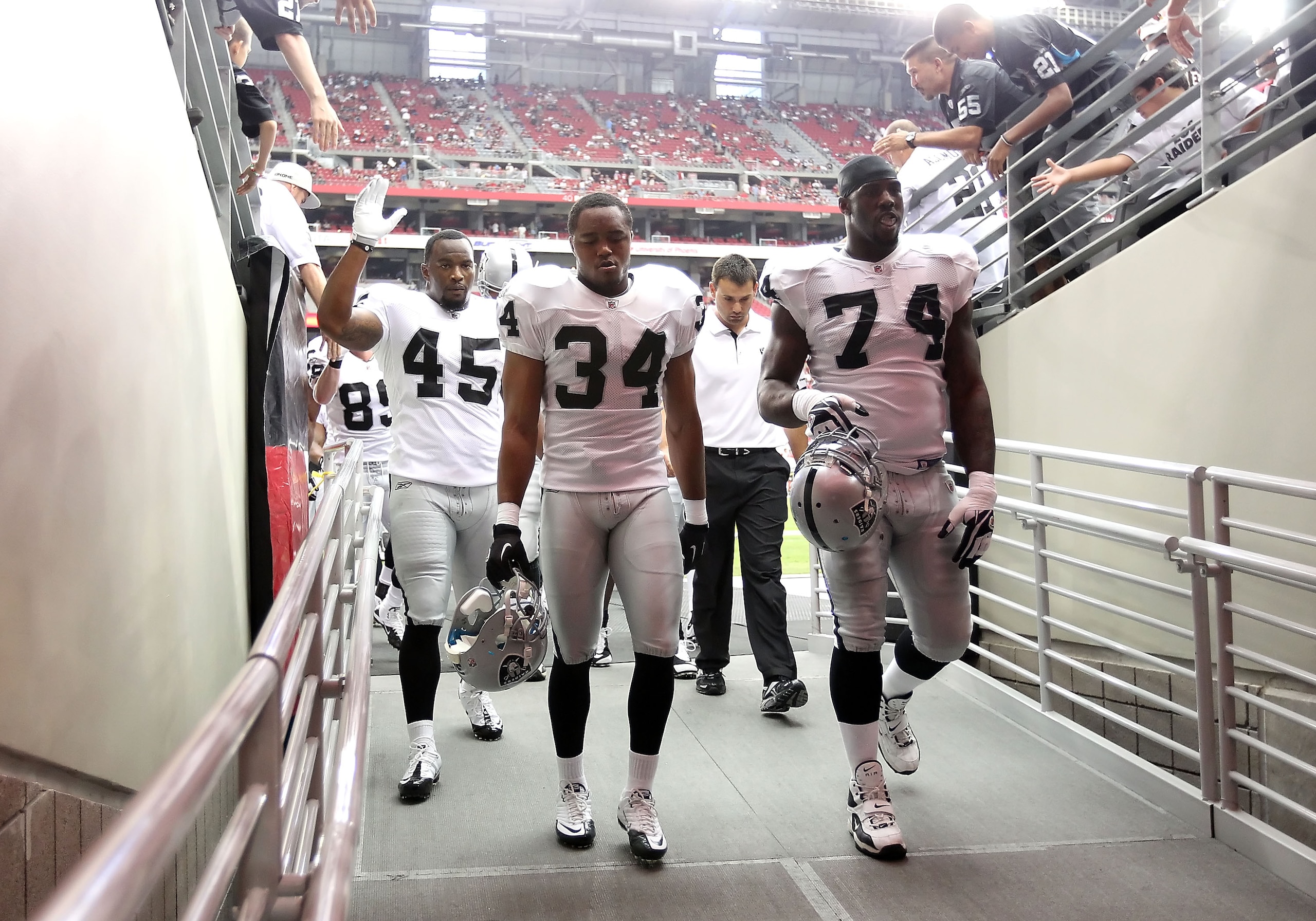 GLENDALE, AZ - SEPTEMBER 26:  (L-R) Marcel Reece #45, Mike Mitchell #34 and Bruce Campbell #73 of the Oakland Raiders before the NFL game against the Arizona Cardinals at the University of Phoenix Stadium on September 26, 2010 in Glendale, Arizona.  The C