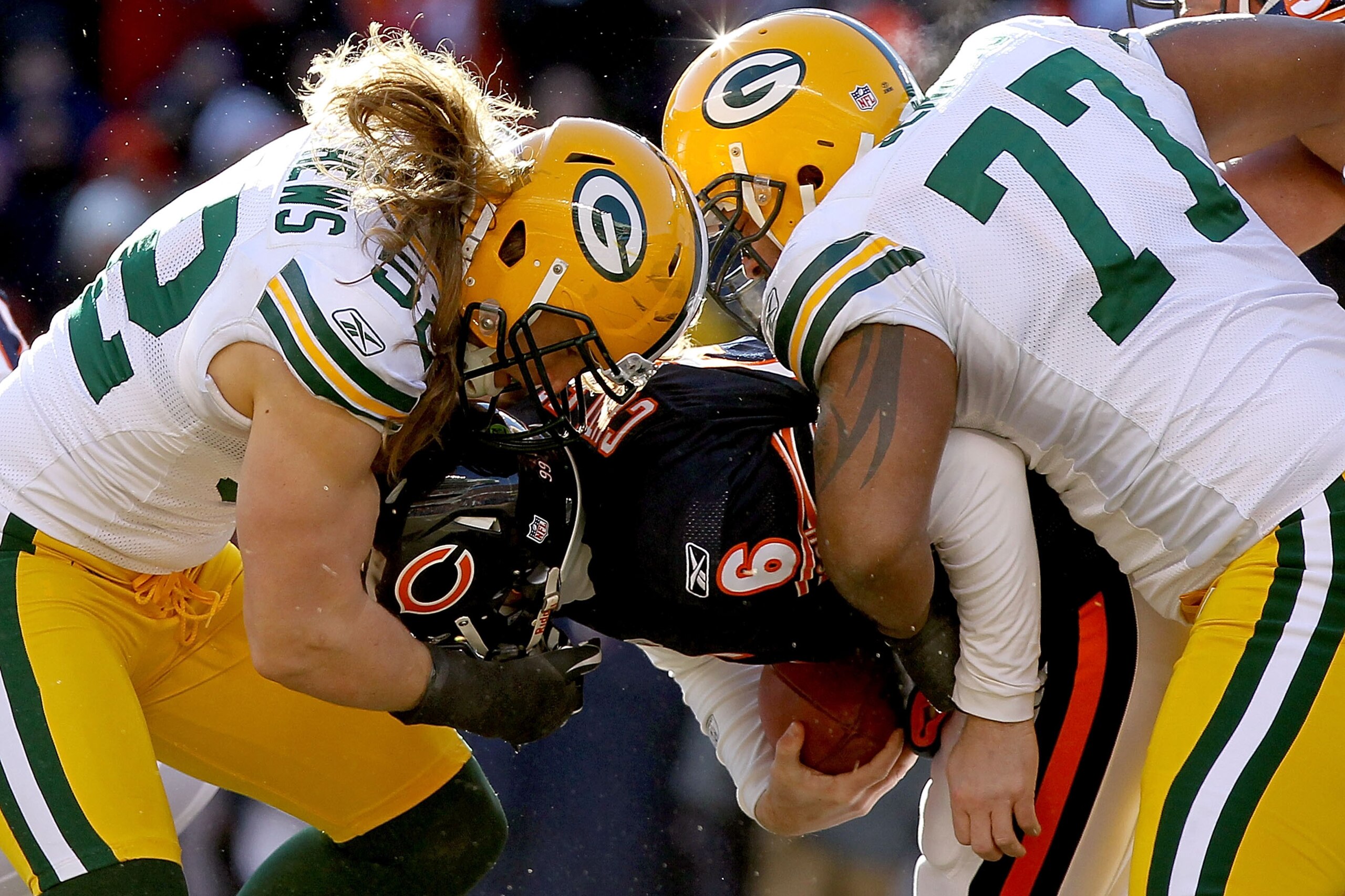 CHICAGO, IL - JANUARY 23:  Linebacker Clay Matthews #52 and Cullen Jenkins #77 of the Green Bay Packers sack quarterback Jay Cutler #6 of the Chicago Bears in the first half of the NFC Championship Game at Soldier Field on January 23, 2011 in Chicago, Ill