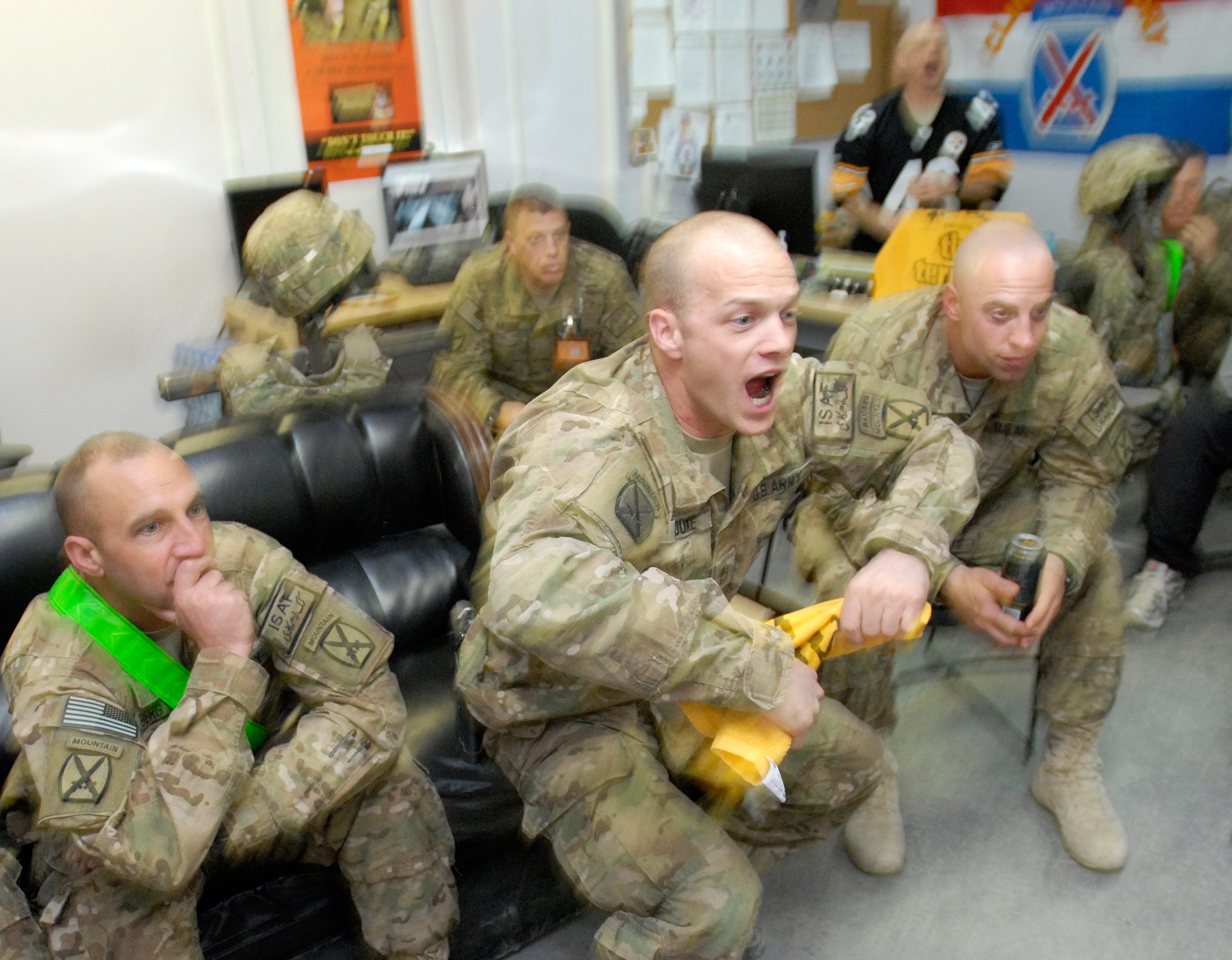 KANDAHAR, AFGHANISTAN - FEBRUARY 7:  In this photo provided by ISAF Regional Command (South), (L-R) Sgt. Carl Berg, Sgt. 1st Class Willard Brooks and Sgt. 1st Class Daniel Keller of the 10th Mountain Division from Fort Drum in New York, react to a second-