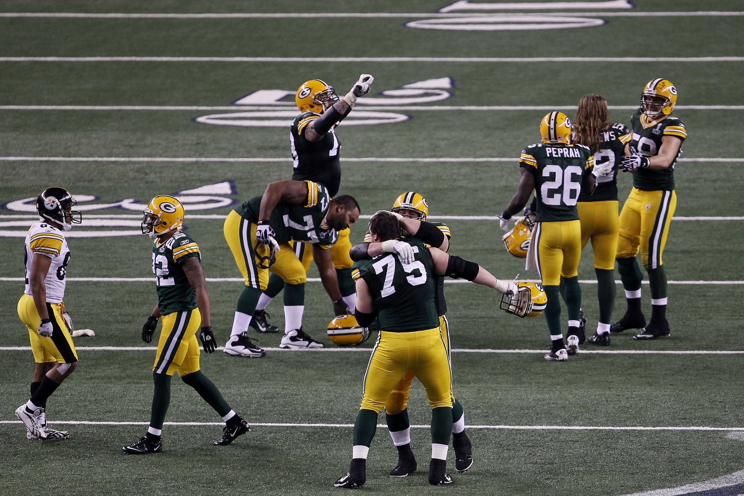 ARLINGTON, TX - FEBRUARY 06:  The Green Bay Packers celebrate defeating the Pittsburgh Steelers 31 to 25 in Super Bowl XLV at Cowboys Stadium on February 6, 2011 in Arlington, Texas.  (Photo by Jonathan Daniel/Getty Images)