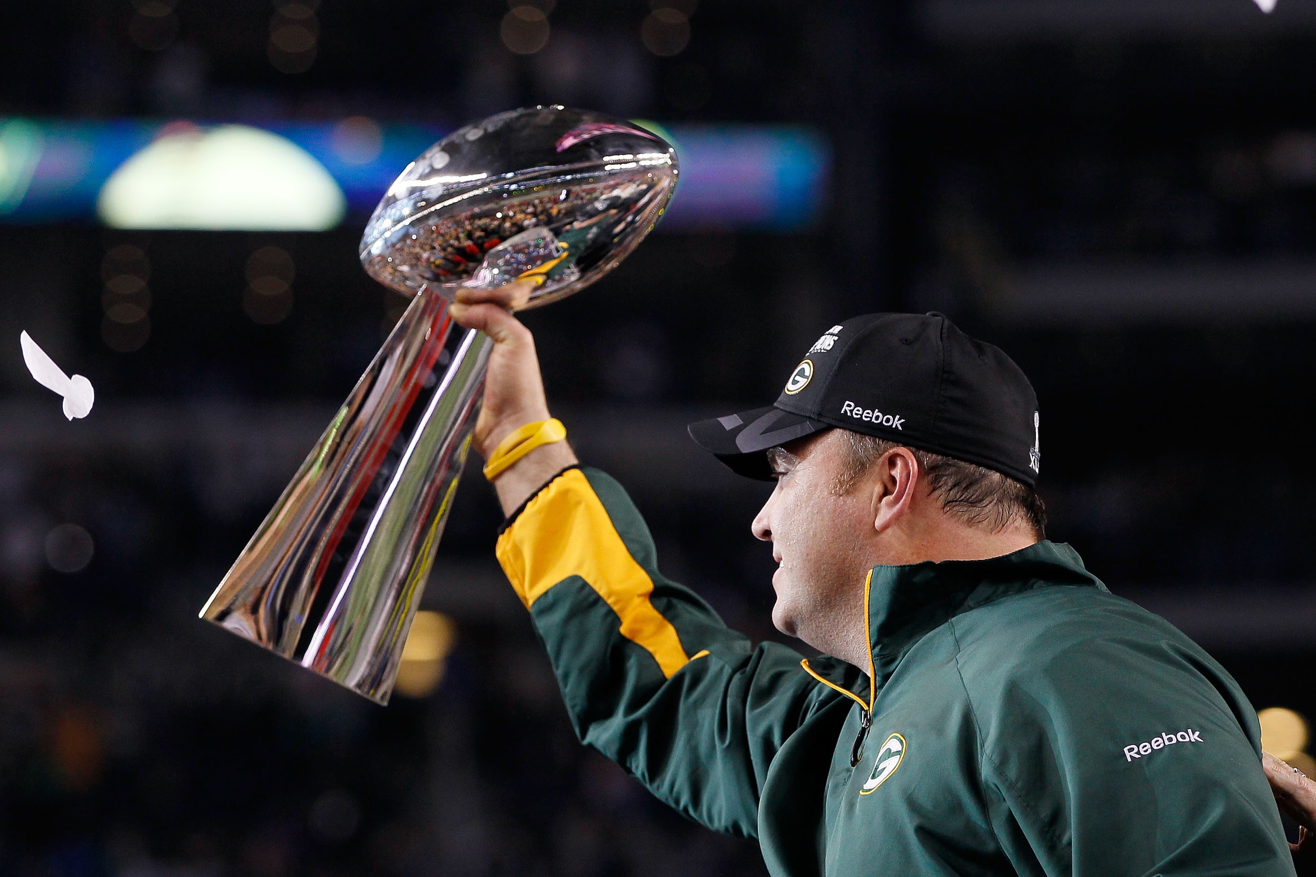 ARLINGTON, TX - FEBRUARY 06:  Head coach Mike McCarthy of the Green Bay Packers holds up the Vince Lombardi Trophy after winning Super Bowl XLV 31-25 against the Pittsburgh Steelers at Cowboys Stadium on February 6, 2011 in Arlington, Texas.  (Photo by Ke