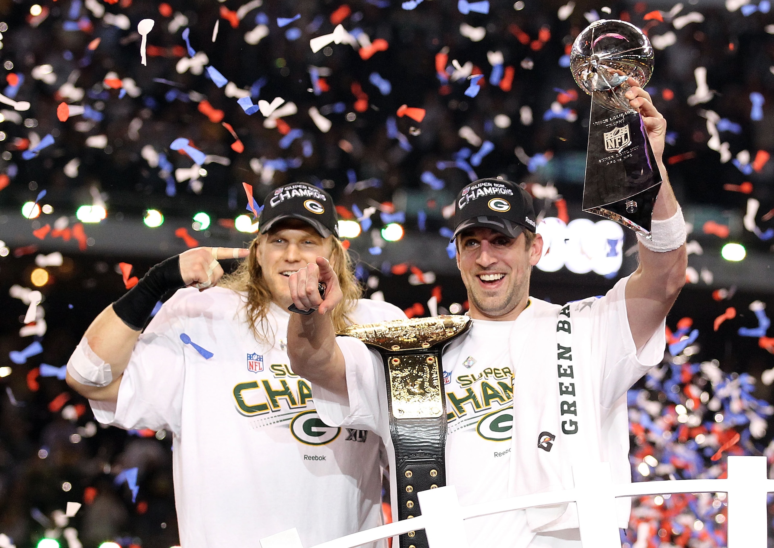 ARLINGTON, TX - FEBRUARY 06:  Super Bowl MVP Aaron Rodgers #12 of the Green Bay Packers holds up the Vince Lombardi Trophy as Clay Matthews #52 looks on after winning Super Bowl XLV 31-25 against the Pittsburgh Steelers at Cowboys Stadium on February 6, 2