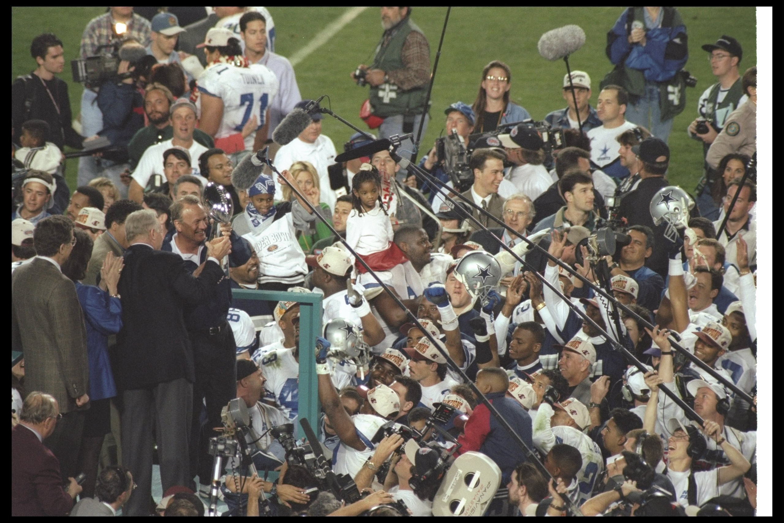 28 Jan 1996:  Dallas Cowboys owner Jerry Jones and head coach Barry Switzer celebrate after Super Bowl XXX against the Pittsburgh Steelers at Sun Devil Stadium in Tempe, Arizona.  The Cowboys won the game, 27-17. Mandatory Credit: Otto Greule Jr.  /Allspo