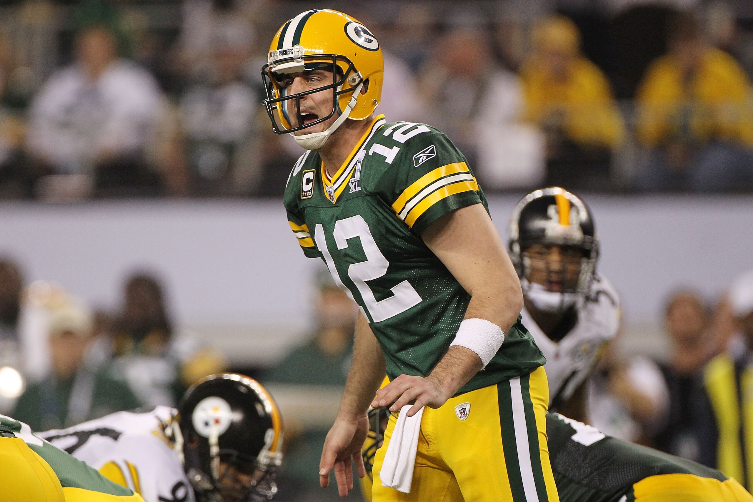 ARLINGTON, TX - FEBRUARY 06: Aaron Rodgers #12 of the Green Bay Packers calls a play against the Pittsburgh Steelers during Super Bowl XLV at Cowboys Stadium on February 6, 2011 in Arlington, Texas. (Photo by Doug Pensinger/Getty Images) ARLINGTON, TX - FEBRUARY 06: Aaron Rodgers #12 of the Green Bay Packers calls a play against the Pittsburgh Steelers during Super Bowl XLV at Cowboys Stadium on February 6, 2011 in Arlington, Texas. (Photo by Doug Pensinger/Getty Images)