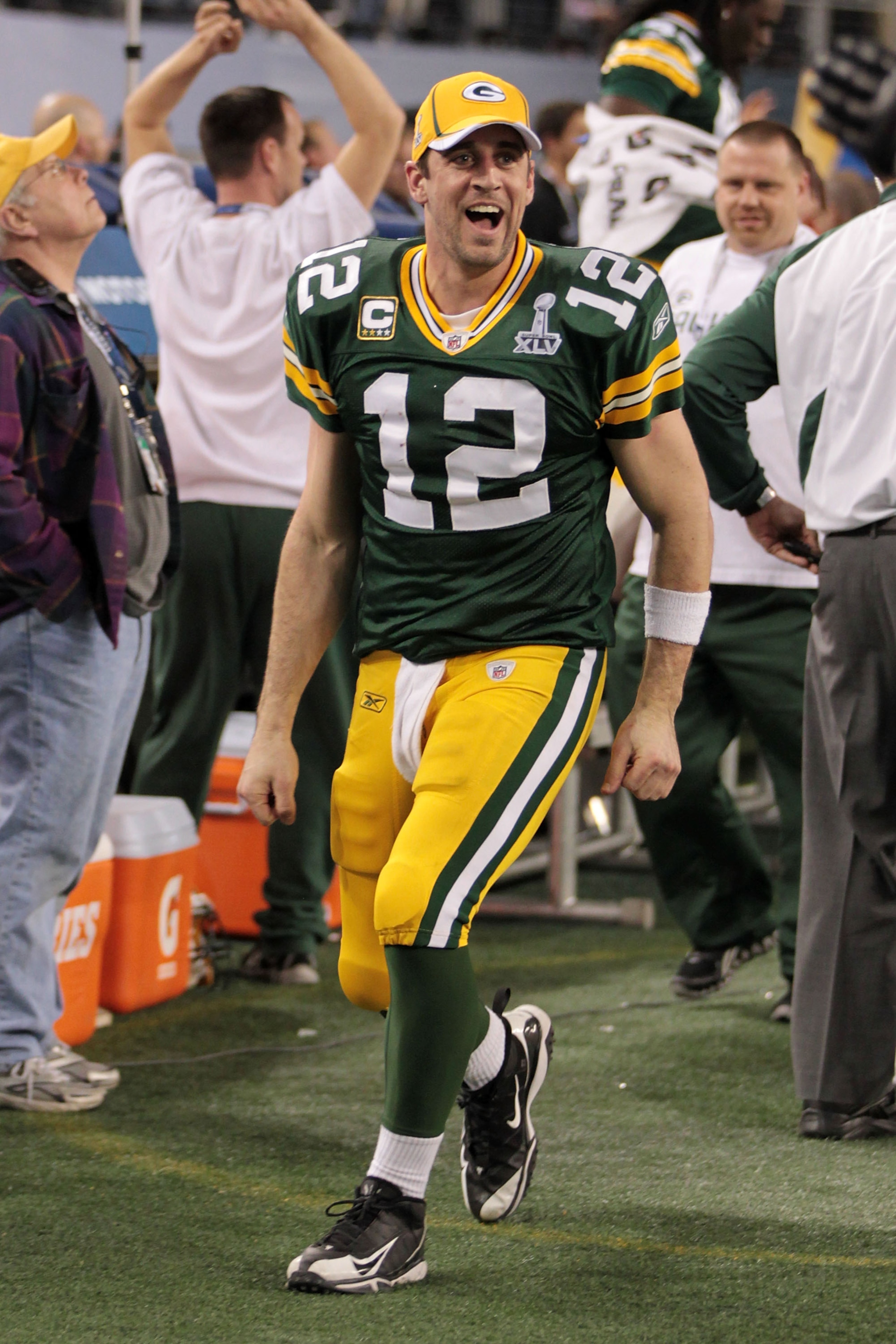 ARLINGTON, TX - FEBRUARY 06:  Aaron Rodgers #12 of the Green Bay Packers celebrates after they defeated the Pittsburgh Steelers 31 to 25 in Super Bowl XLV at Cowboys Stadium on February 6, 2011 in Arlington, Texas.  (Photo by Jamie Squire/Getty Images)