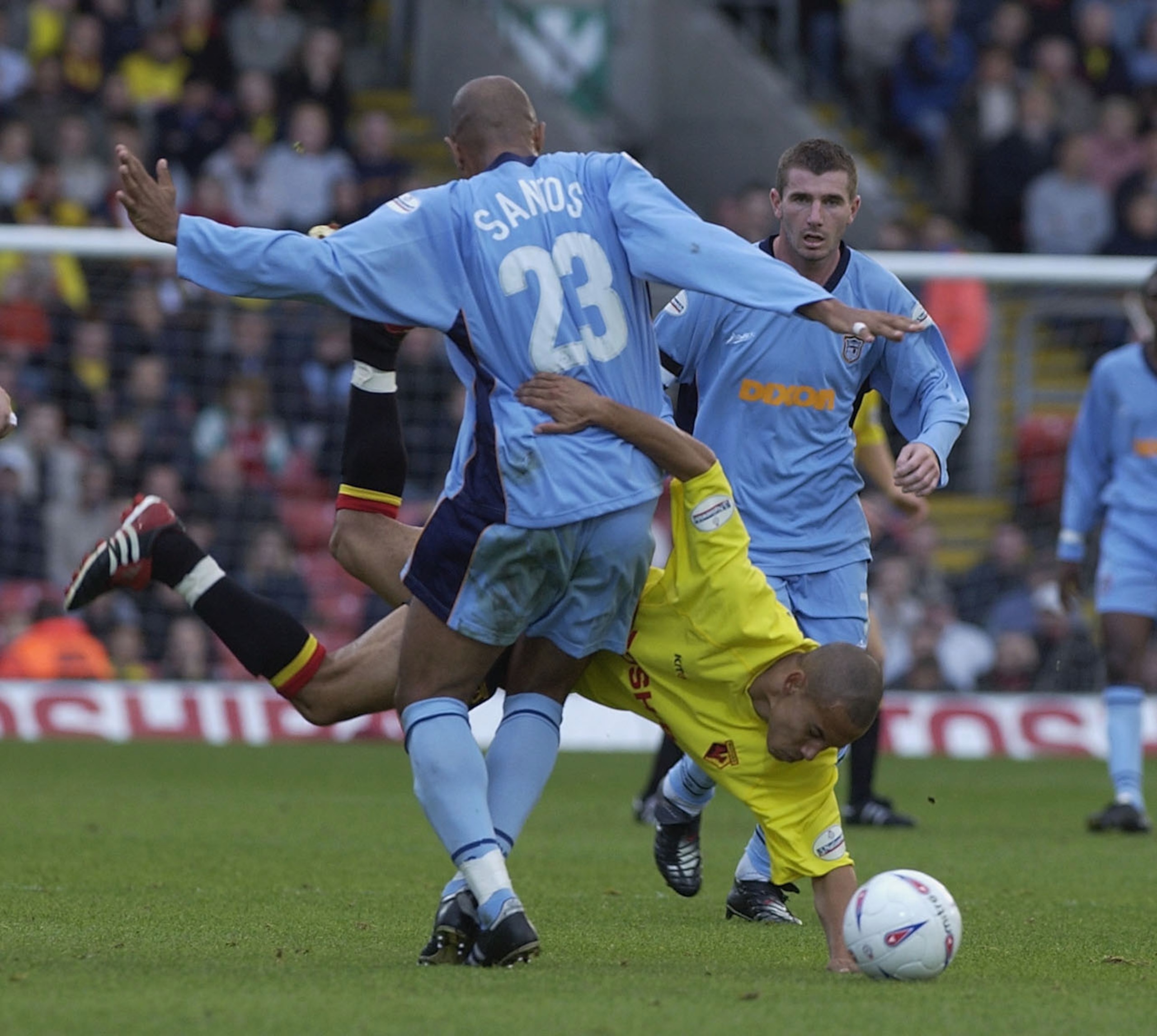 WATFORD - OCTOBER 12: Danny Webber of Watford is up-ended by Georges Santos of Grimsby during the Nationwide League Division One match between Watford and Grimsby Town at Vicarage Road, Watford, England on October 12, 2002. (Photo by Clive Brunskill/Getty