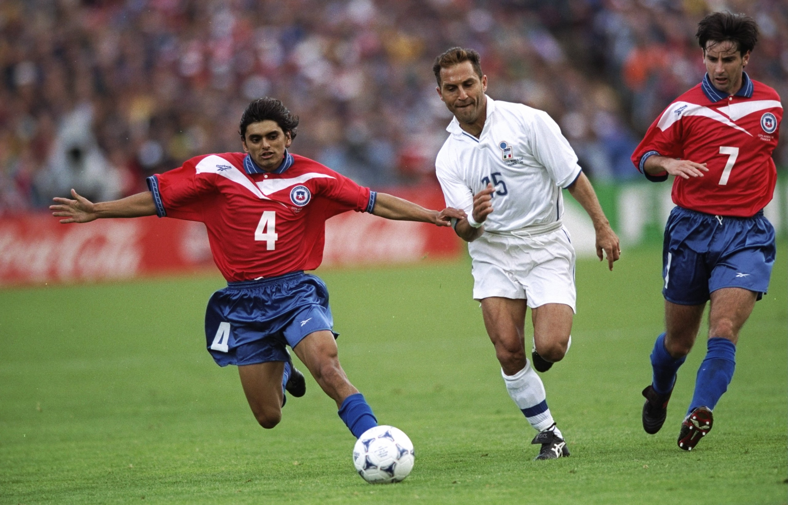 11 Jun 1998:  Angelo Di Livio of Italy takes on Francisco Rojas and Nelson Parraguez of Chile during the World Cup group B game at the Parc Lescure in Bordeaux, France. The match ended 2-2.  \ Mandatory Credit: Shaun Botterill /Allsport