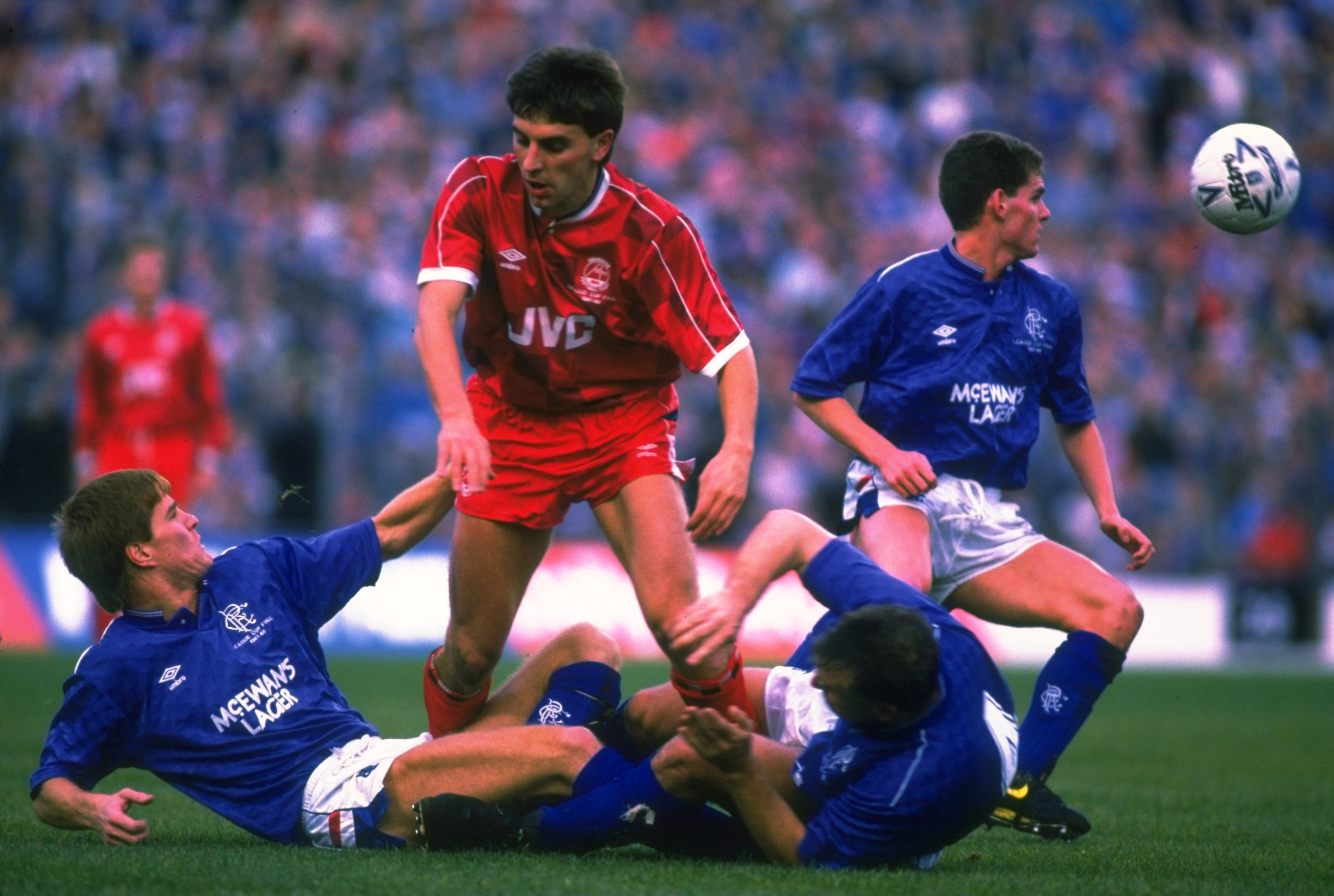 1988:  John Hewitt (centre) of Aberdeen helps up Richard Gough (bottom left) of Rangers while Graham Roberts (bottom right) of Rangers struggles to his feet during the Skol Cup Final match at Hampden Park in Glasgow, Scotland.The match ended in a 3-3 draw