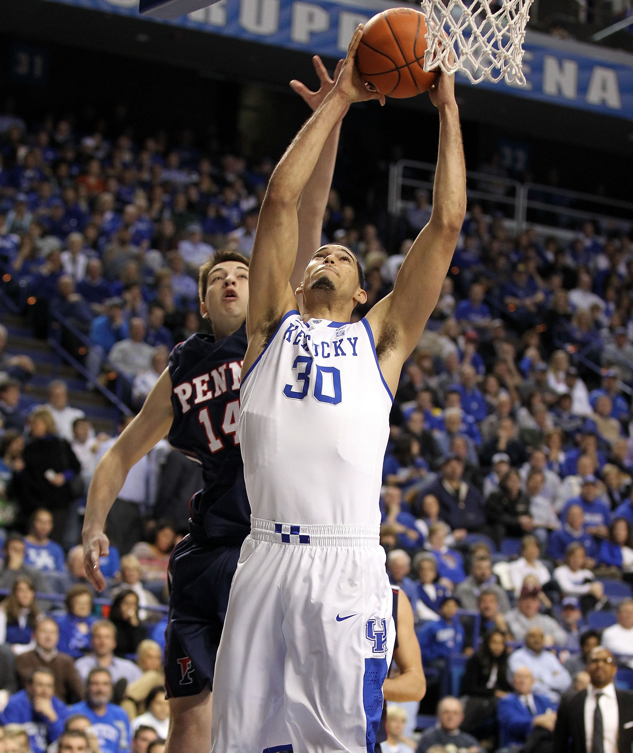 LEXINGTON, KY - JANUARY 03: Eloy Vargas #30 of the Kentucky Wildcats shoots the ball while defended by Fran Dougherty #14 of the Penn Quakers at Rupp Arena on January 3, 2011 in Lexington, Kentucky. Kentucky won 86-62. (Photo by Andy Lyons/Getty Images LEXINGTON, KY - JANUARY 03: Eloy Vargas #30 of the Kentucky Wildcats shoots the ball while defended by Fran Dougherty #14 of the Penn Quakers at Rupp Arena on January 3, 2011 in Lexington, Kentucky. Kentucky won 86-62. (Photo by Andy Lyons/Getty Images