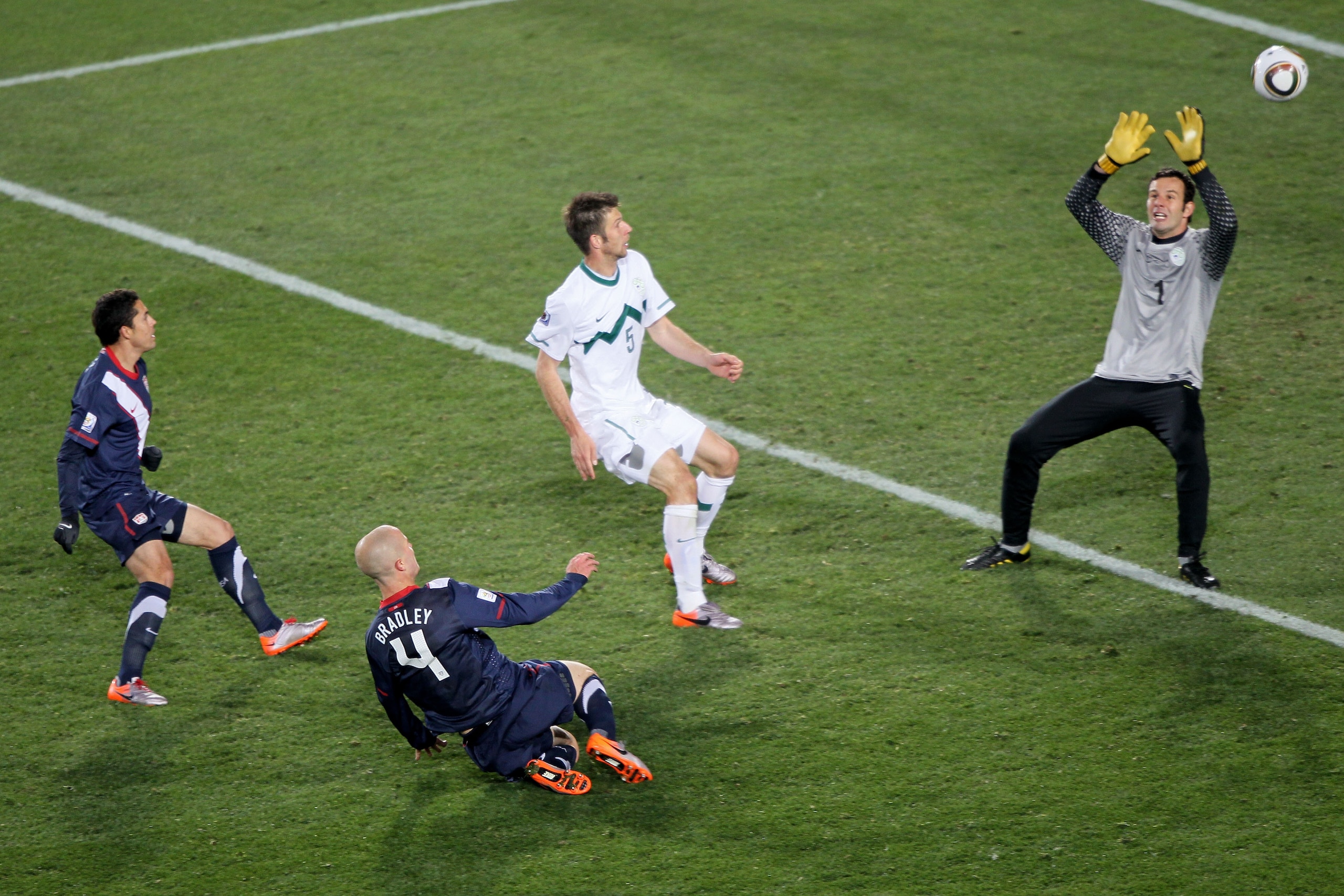 JOHANNESBURG, SOUTH AFRICA - JUNE 18:  Michael Bradley of the United States scores his side's second goal past Samir Handanovic of Slovenia during the 2010 FIFA World Cup South Africa Group C match between Slovenia and USA at Ellis Park Stadium on June 18