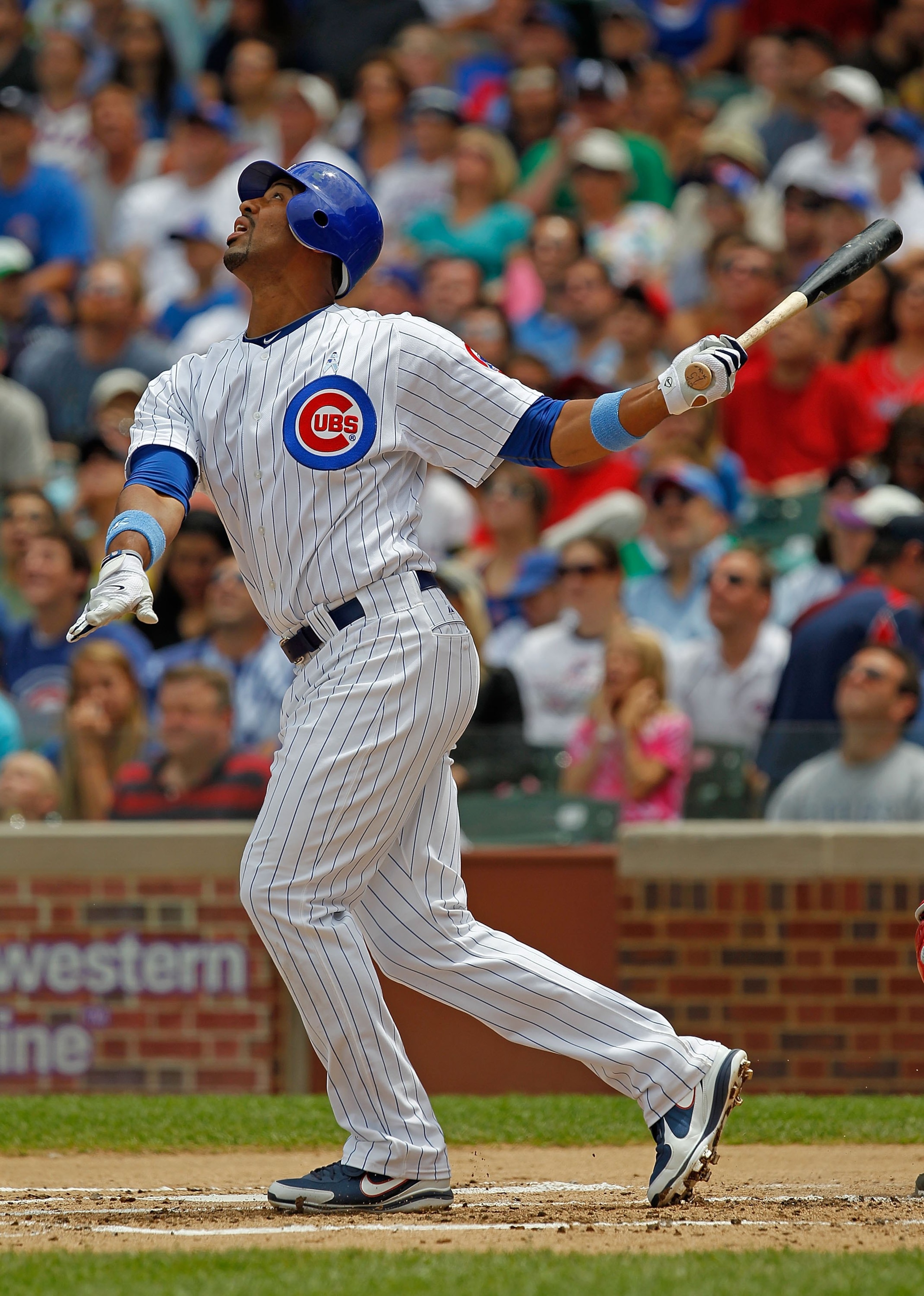 CHICAGO - JUNE 20: Derrek Lee #25 of the Chicago Cubs hits the ball against the Los Angeles Angels of Anaheim at Wrigley Field on June 20, 2010 in Chicago, Illinois. The Cubs defeated the Angels 12-1. (Photo by Jonathan Daniel/Getty Images) CHICAGO - JUNE 20: Derrek Lee #25 of the Chicago Cubs hits the ball against the Los Angeles Angels of Anaheim at Wrigley Field on June 20, 2010 in Chicago, Illinois. The Cubs defeated the Angels 12-1. (Photo by Jonathan Daniel/Getty Images)
