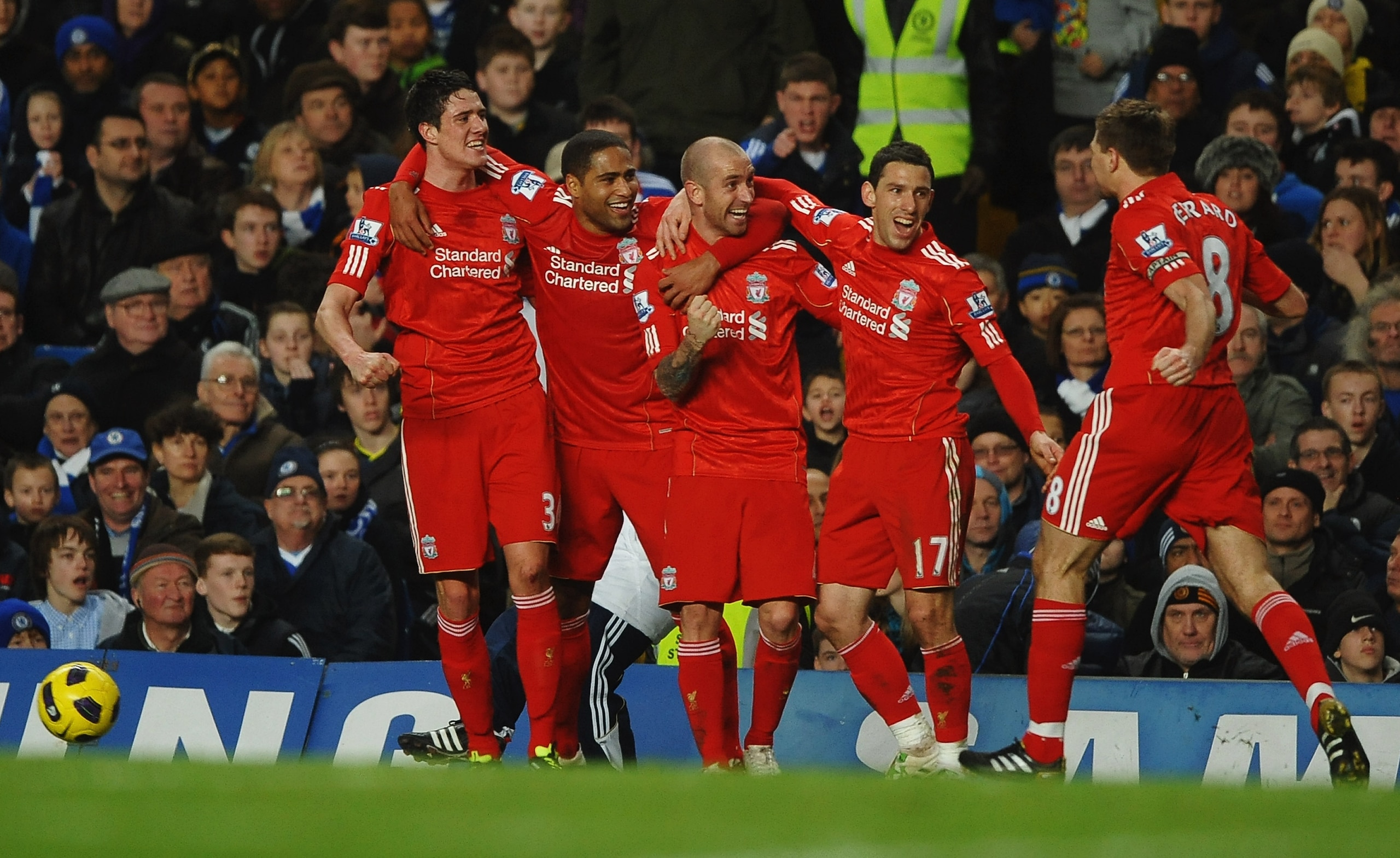 LONDON, ENGLAND - FEBRUARY 06: Raul Meireles of Liverpool (C) celebrates with teammates as he scores their first goal during the Barclays Premier League match between Chelsea and Liverpool at Stamford Bridge on February 6, 2011 in London, England. (Phot LONDON, ENGLAND - FEBRUARY 06: Raul Meireles of Liverpool (C) celebrates with teammates as he scores their first goal during the Barclays Premier League match between Chelsea and Liverpool at Stamford Bridge on February 6, 2011 in London, England. (Phot