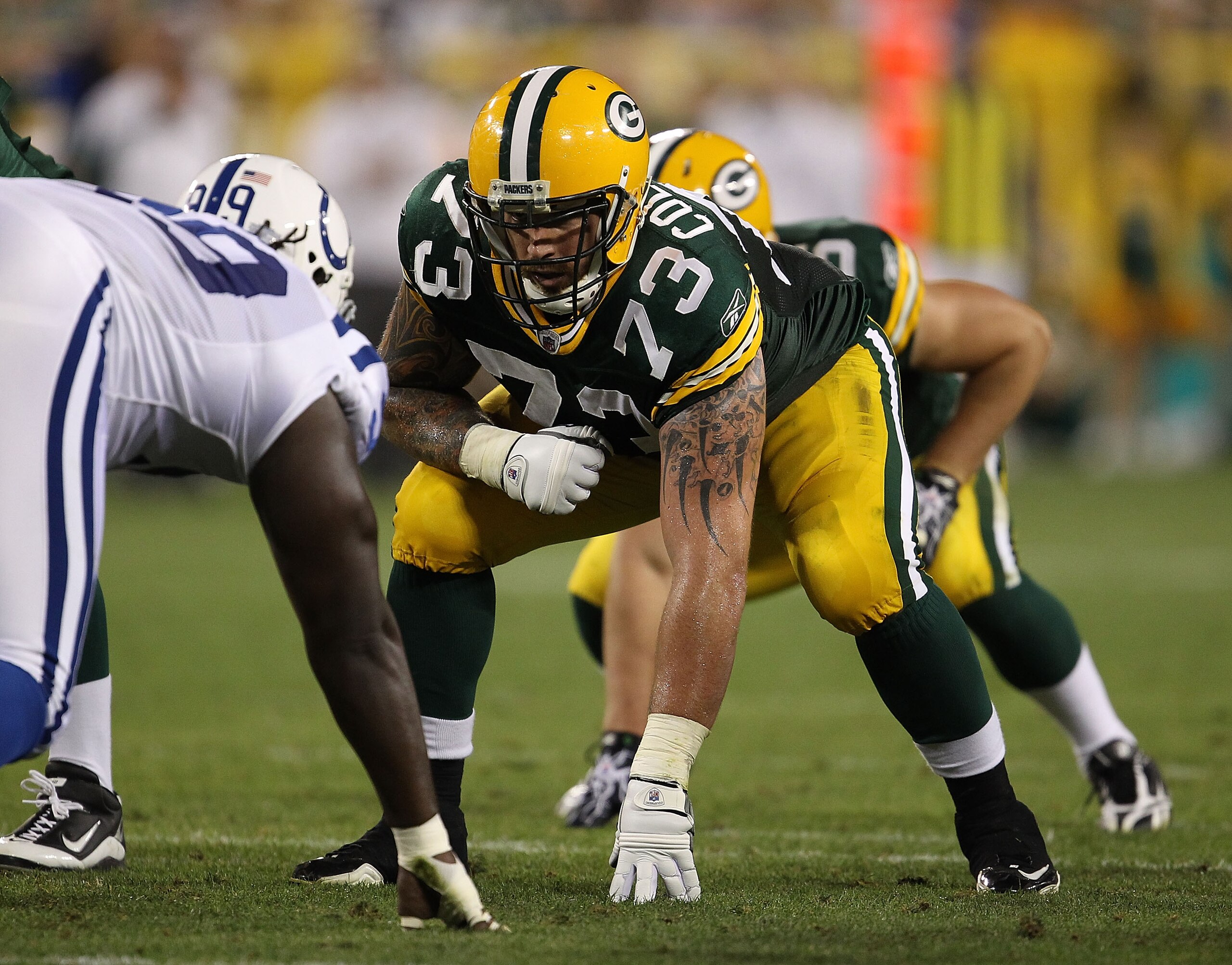 GREEN BAY, WI - AUGUST 26: Daryn Colledge #73 of the Green Bay Packers awaits the start of play against the Indianapolis Colts during a preseason game at Lambeau Field on August 26, 2010 in Green Bay, Wisconsin. The Packers defeated the Colts 59-24. (Phot