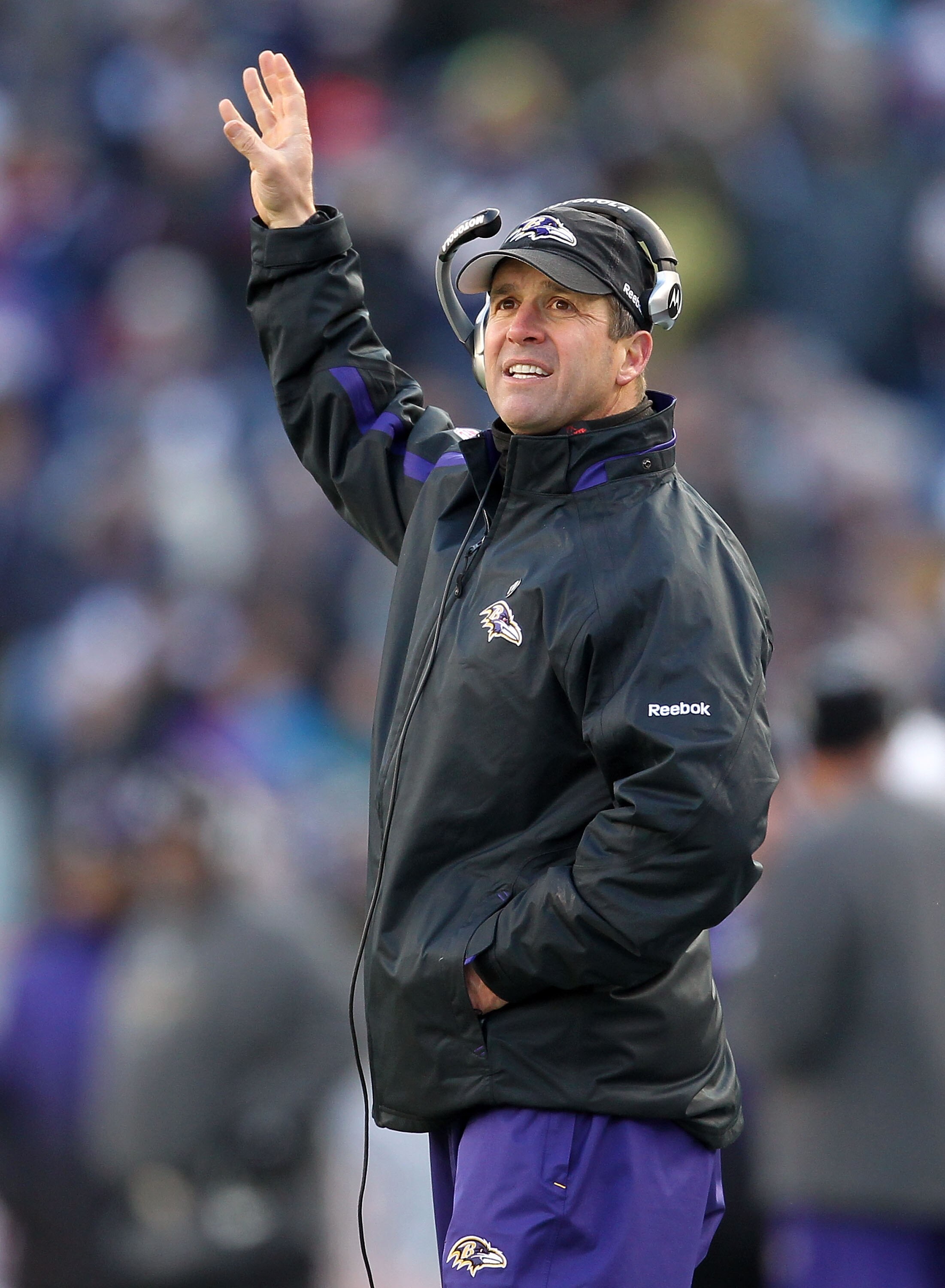 FOXBORO, MA - JANUARY 10:  Head coach John Harbaugh of the Baltimore Ravens gestures as he coaches against the New England Patriots during the 2010 AFC wild-card playoff game at Gillette Stadium on January 10, 2010 in Foxboro, Massachusetts.  (Photo by Ji