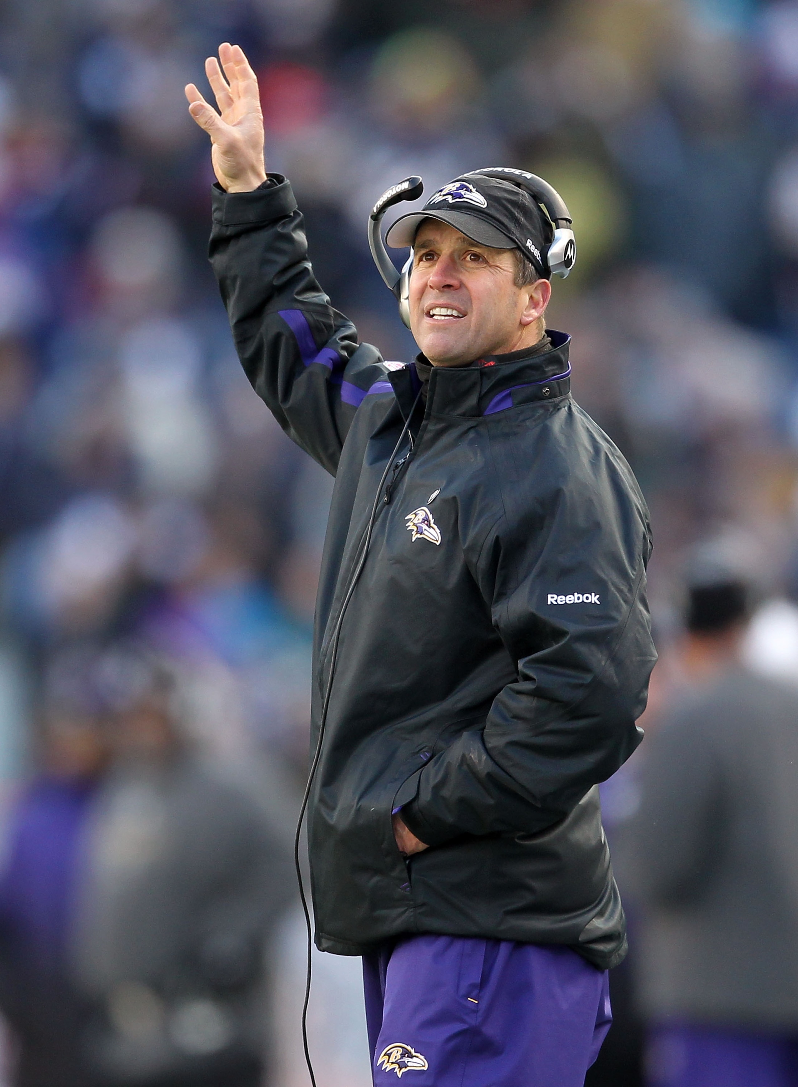 FOXBORO, MA - JANUARY 10:  Head coach John Harbaugh of the Baltimore Ravens gestures as he coaches against the New England Patriots during the 2010 AFC wild-card playoff game at Gillette Stadium on January 10, 2010 in Foxboro, Massachusetts.  (Photo by Ji