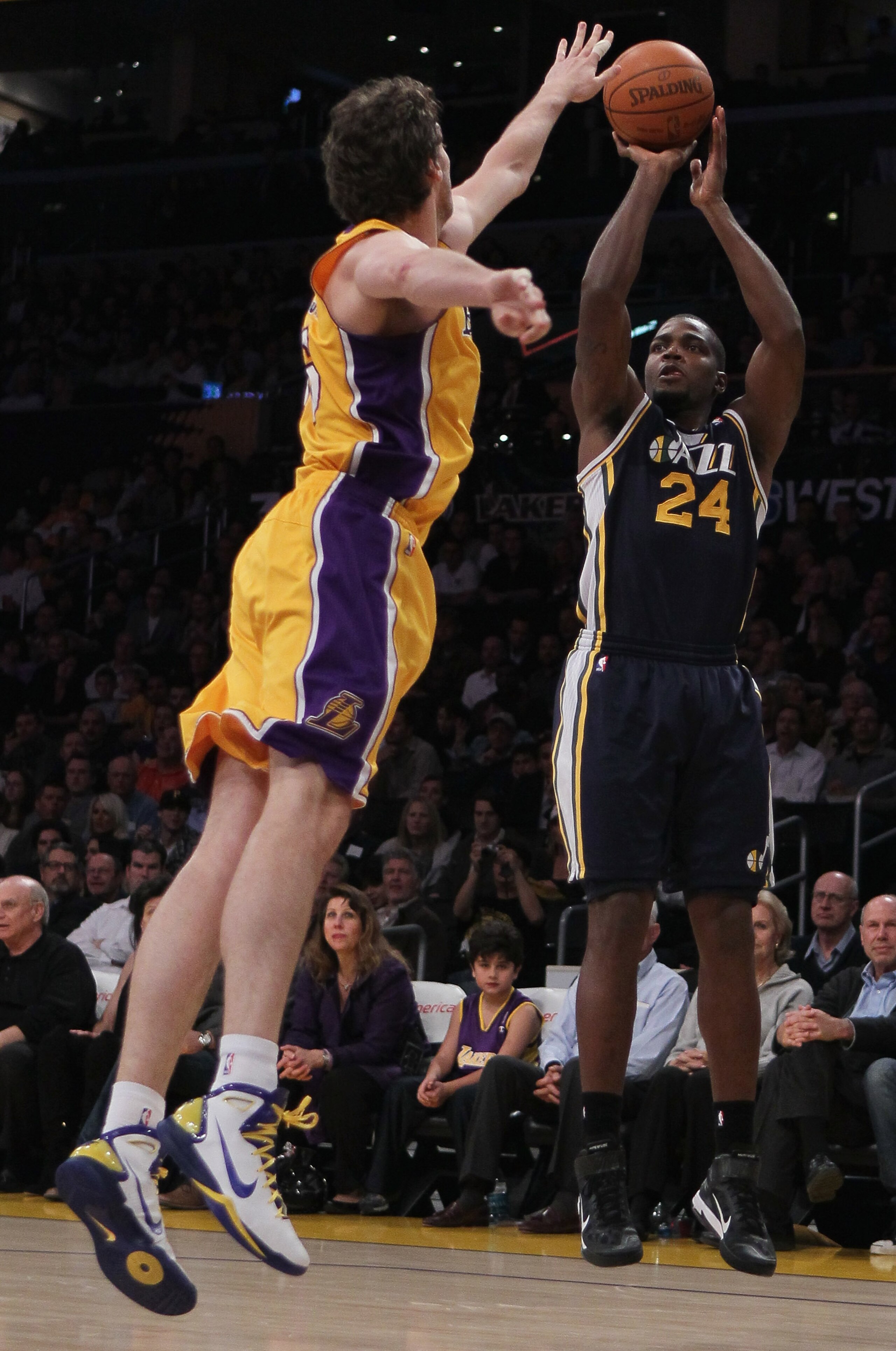 LOS ANGELES, CA - JANUARY 25:  Paul Millsap #24 of the Utah Jazz shoots over Pau Gasol #16 of the Los Angeles Lakers in the first half at Staples Center on January 25, 2011 in Los Angeles, California. NOTE TO USER: User expressly acknowledges and agrees t
