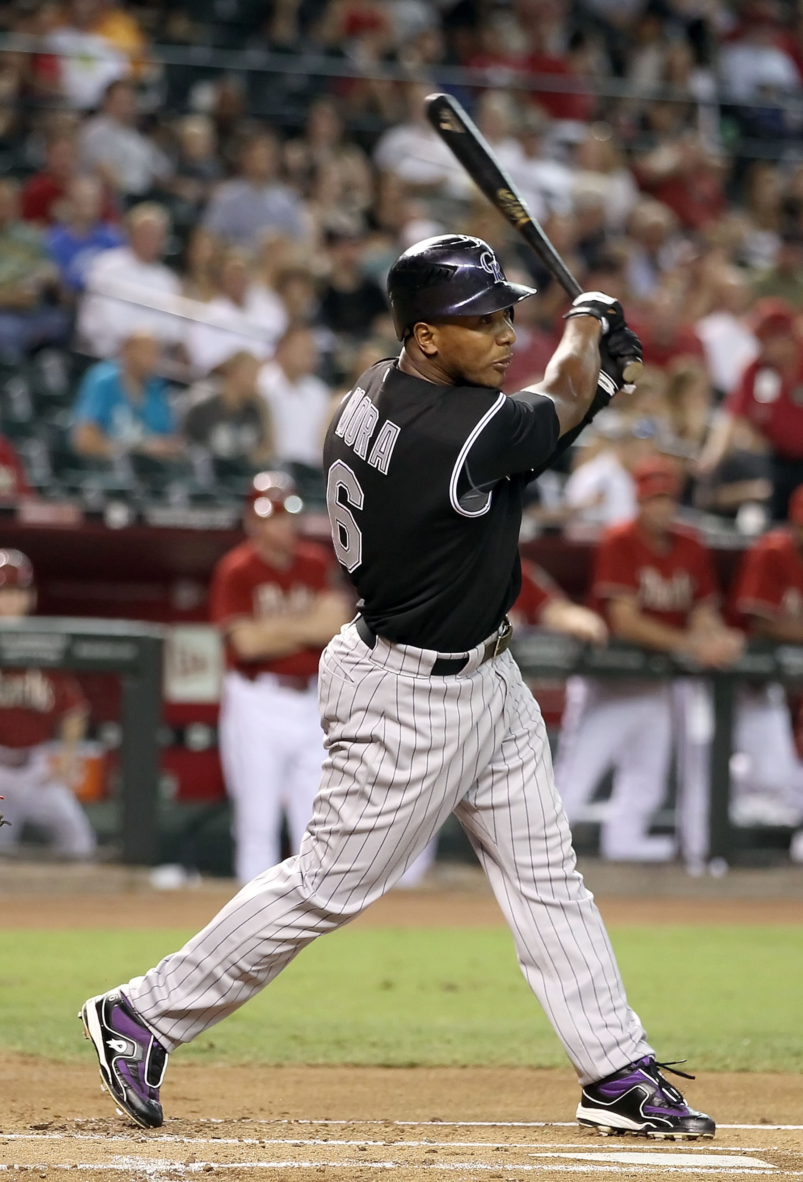 PHOENIX - SEPTEMBER 22:  Melvin Mora #6 of the Colorado Rockies bats against the Arizona Diamondbacks during the Major League Baseball game at Chase Field on September 22, 2010 in Phoenix, Arizona.  (Photo by Christian Petersen/Getty Images)