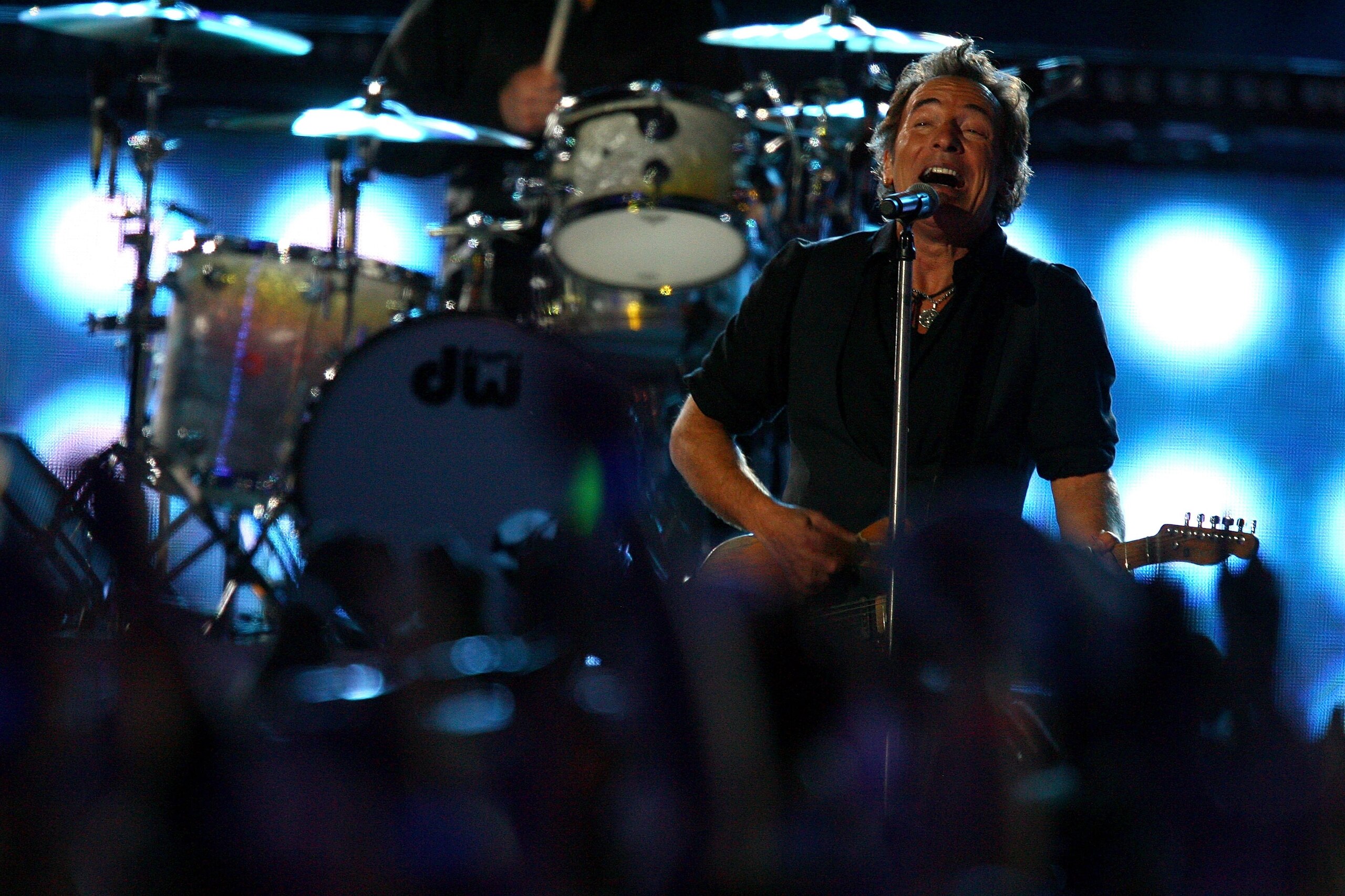 TAMPA, FL - FEBRUARY 01:  Musician Bruce Springsteen and the E Street Band perform at the Bridgestone halftime show during Super Bowl XLIII between the Arizona Cardinals and the Pittsburgh Steelers on February 1, 2009 at Raymond James Stadium in Tampa, Fl