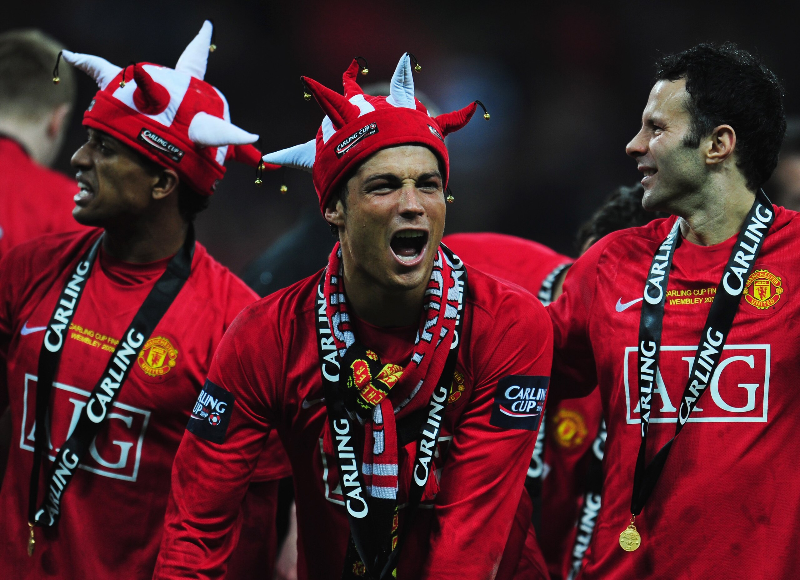 LONDON - MARCH 01:  (L-R) Luis Nani, Cristiano Ronaldo and Ryan Giggs of Manchester United celebrate victory during the Carling Cup Final match between Manchester United and Tottenham Hotspur at Wembley Stadium on March 1, 2009 in London, England.  (Photo