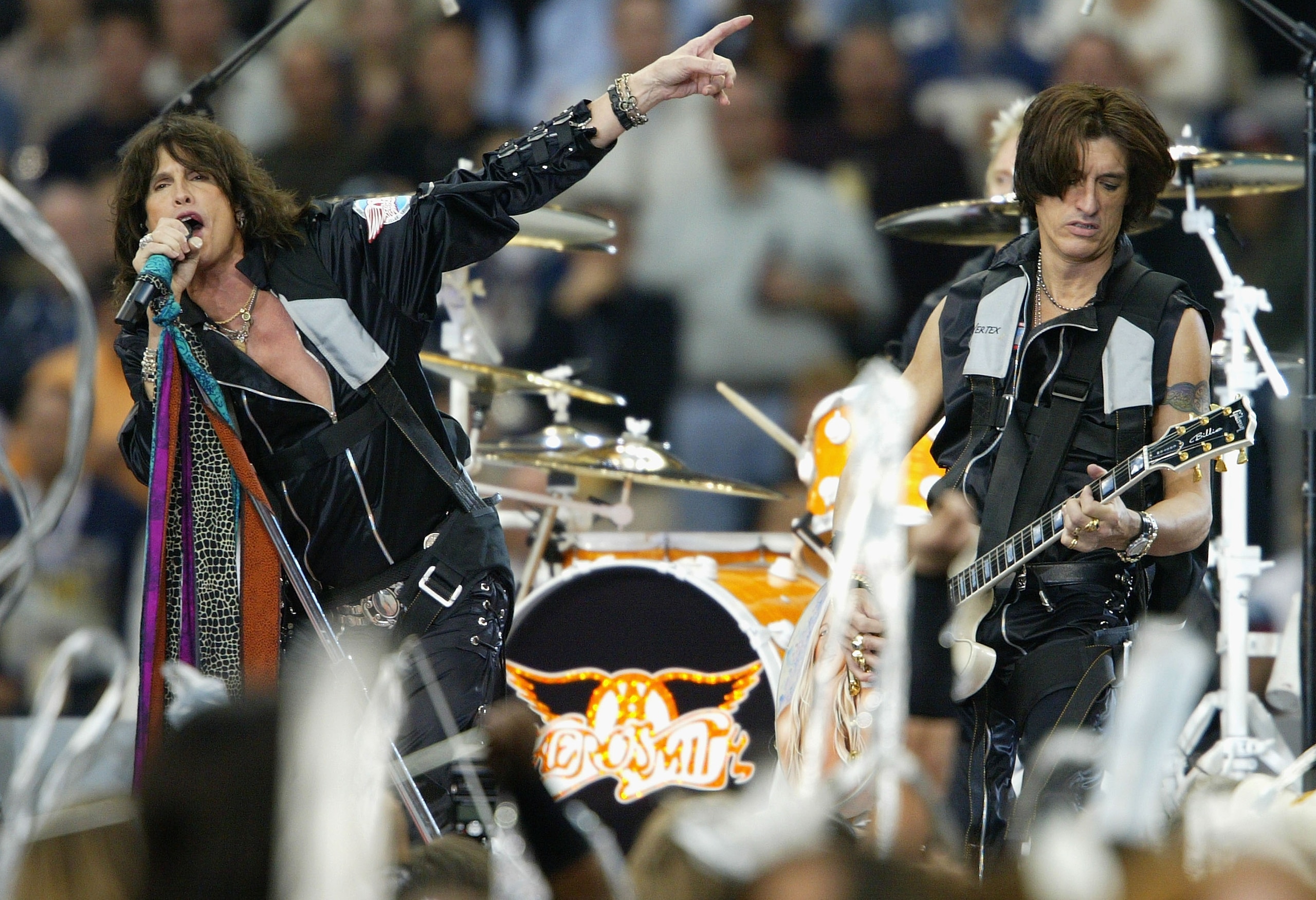 HOUSTON, TX - FEBRUARY 1:  Steven Tyler (left) and Joe Perry of Aerosmith perform during the pre-game show prior to the start of Super Bowl XXXVIII between the New England Patriots and the Carolina Panthers at Reliant Stadium on February 1, 2004 in Housto