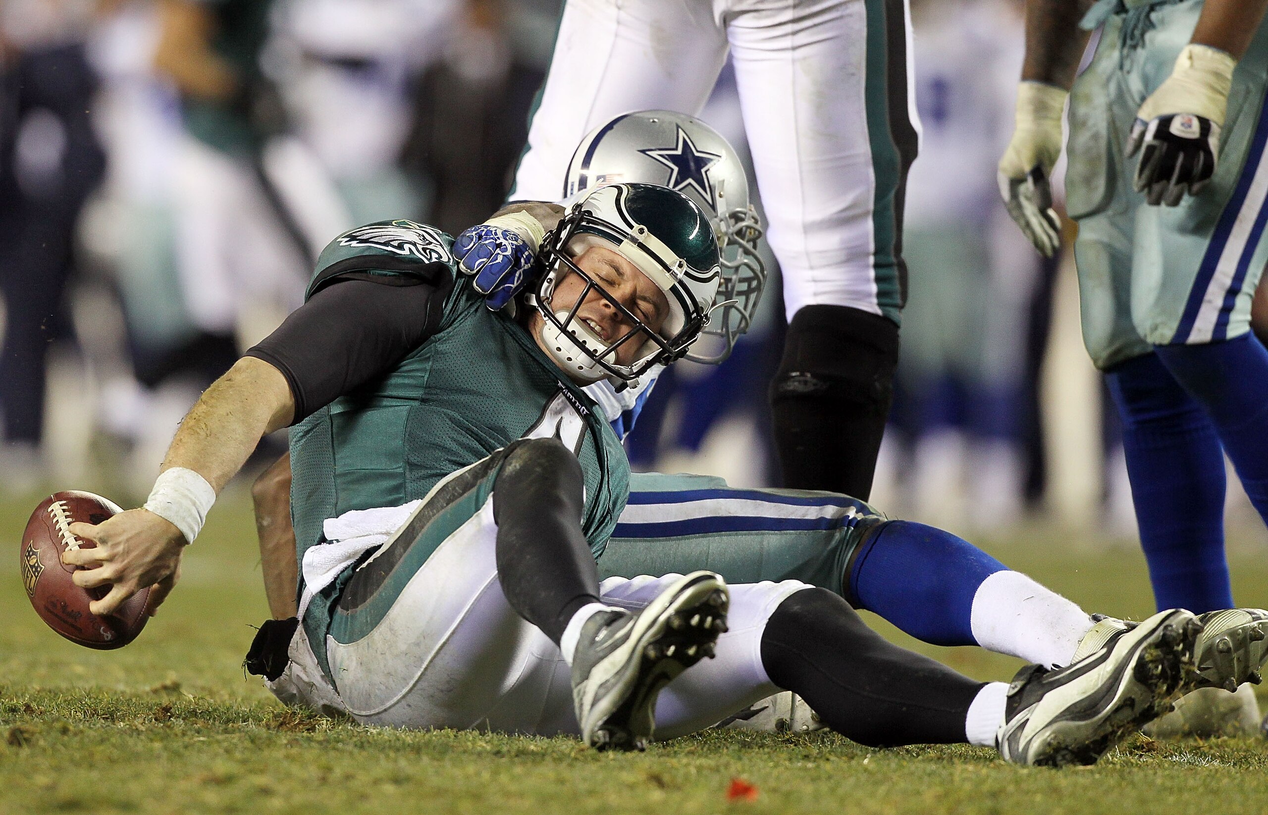 PHILADELPHIA, PA - JANUARY 02: Kevin Kolb #4 of the Philadelphia Eagles is sacked by DeMarcus Ware #94 of the Dallas Cowboys on January 2, 2011 at Lincoln Financial Field in Philadelphia, Pennsylvania. The Cowboys defeated the Eagles 14-13. (Photo by Ji PHILADELPHIA, PA - JANUARY 02: Kevin Kolb #4 of the Philadelphia Eagles is sacked by DeMarcus Ware #94 of the Dallas Cowboys on January 2, 2011 at Lincoln Financial Field in Philadelphia, Pennsylvania. The Cowboys defeated the Eagles 14-13. (Photo by Ji